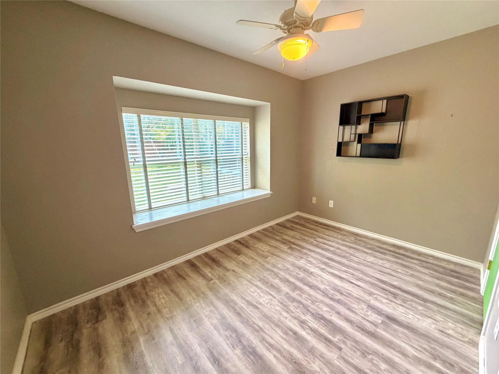 Multi-use room adjacent to the primary bedroom, measuring 8x13. Features a cozy window seat and closet storage. Versatile space perfect for a home office, private workout area, nursery, craft room, or personal retreat.