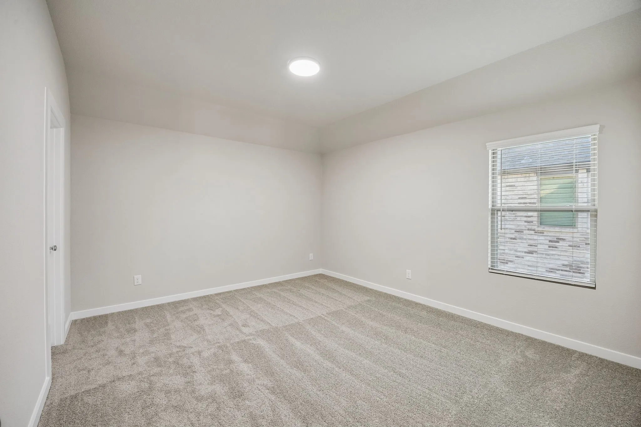 Bedroom in the Wimbledon home plan by Trophy Signature Homes – REPRESENTATIVE PHOTO