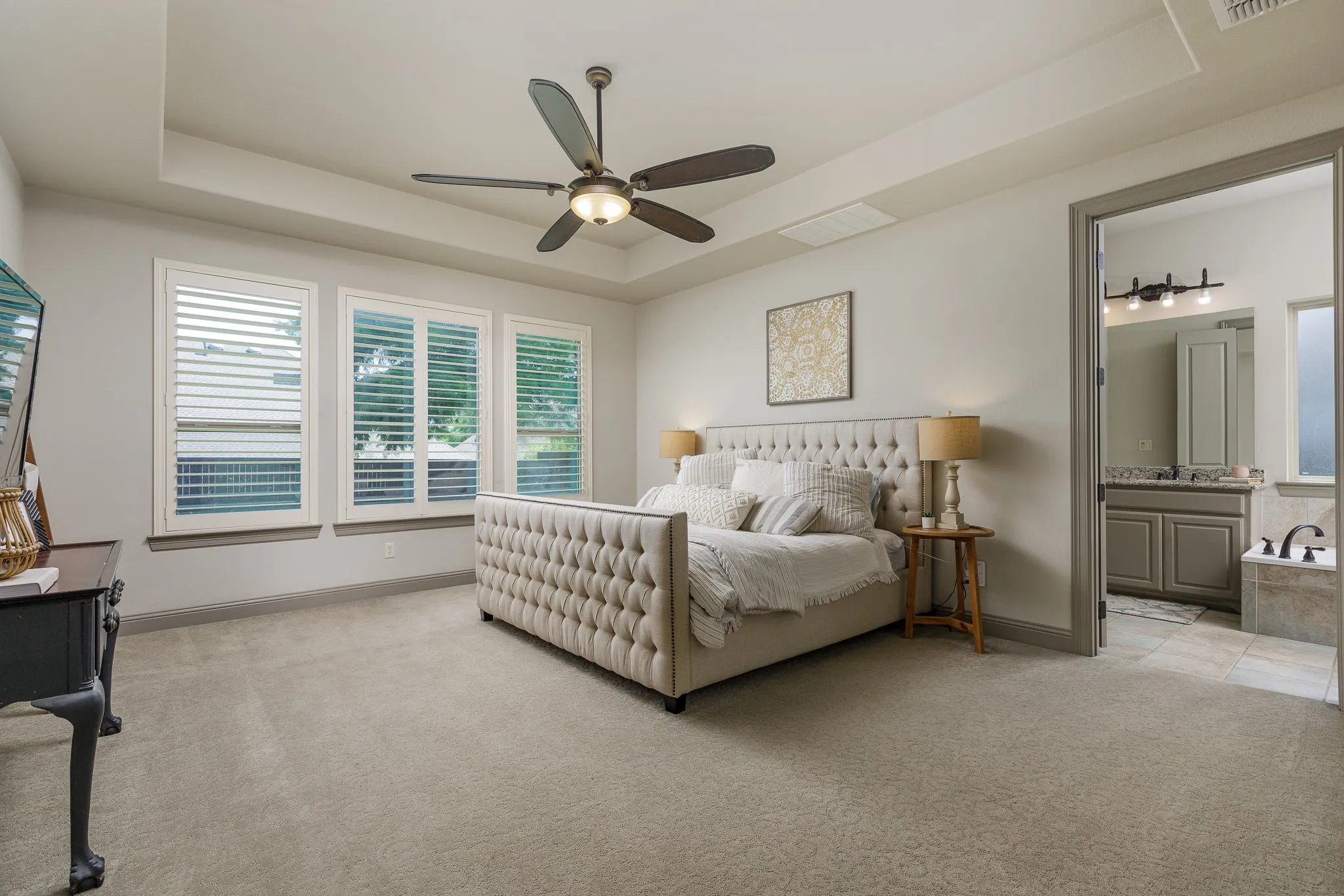 Primary bedroom overlooks the backyard