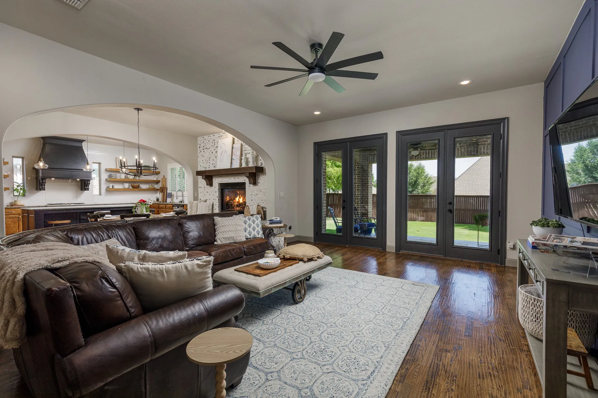 Living area features large glass doors overlooking the backyard
