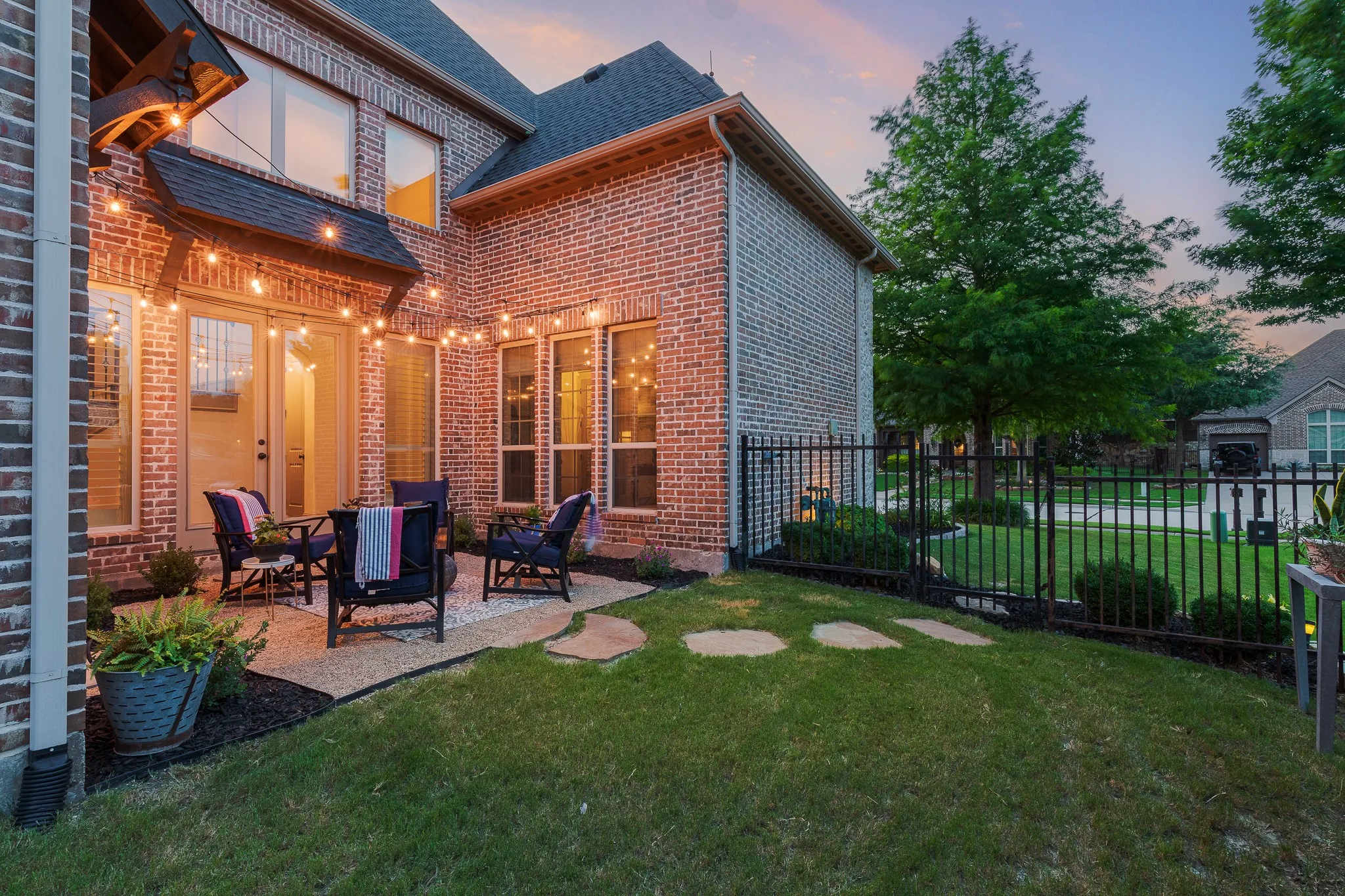 Side patio with string party lights