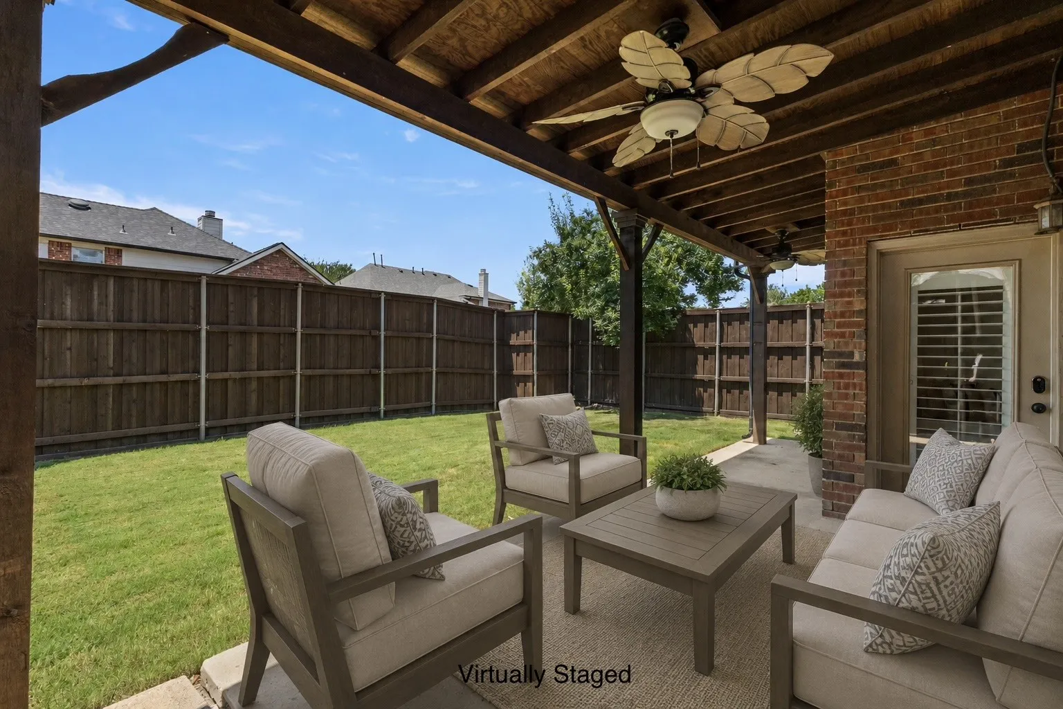 Covered patio with fan, virtually staged