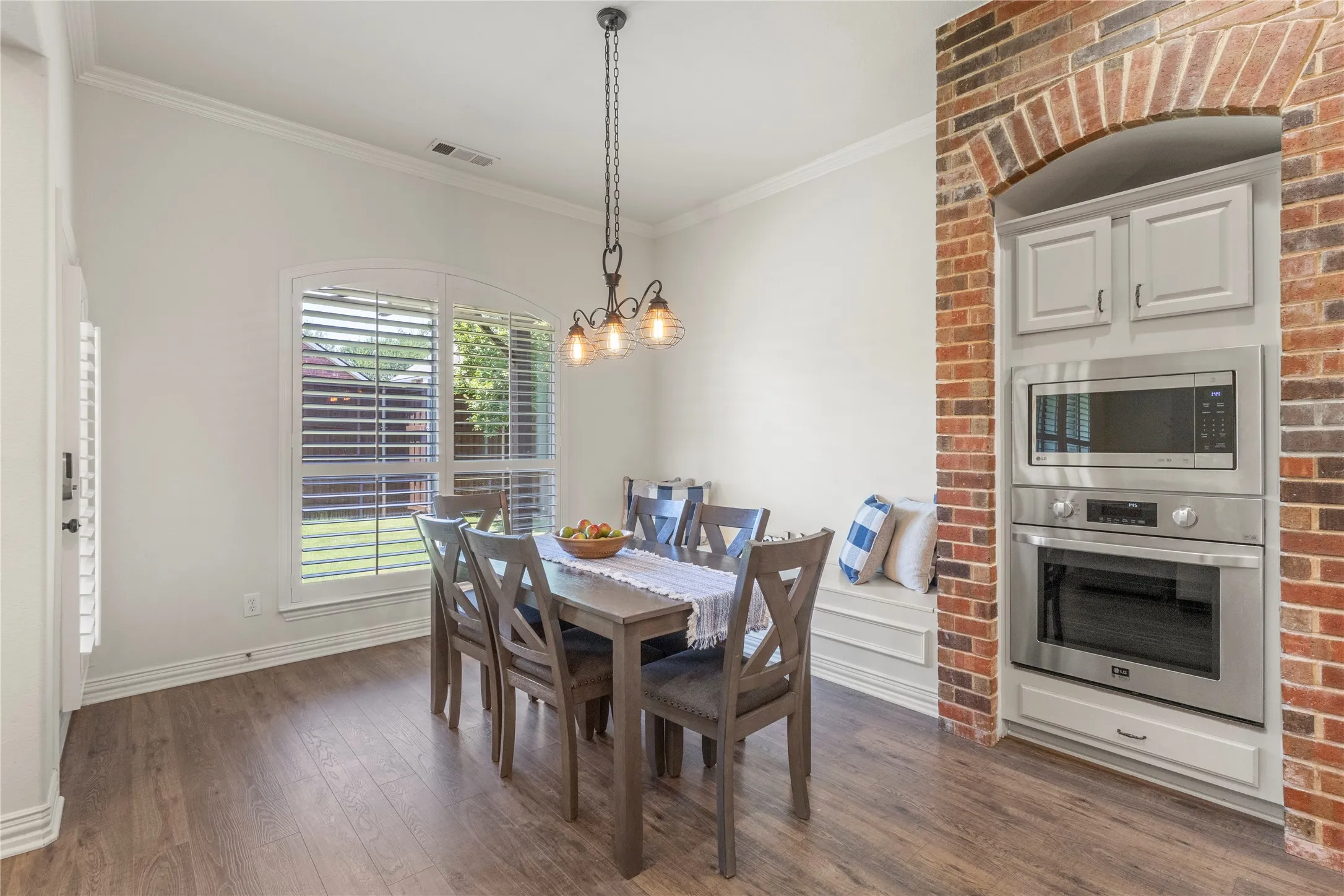 Open to living and dining overlooking backyard