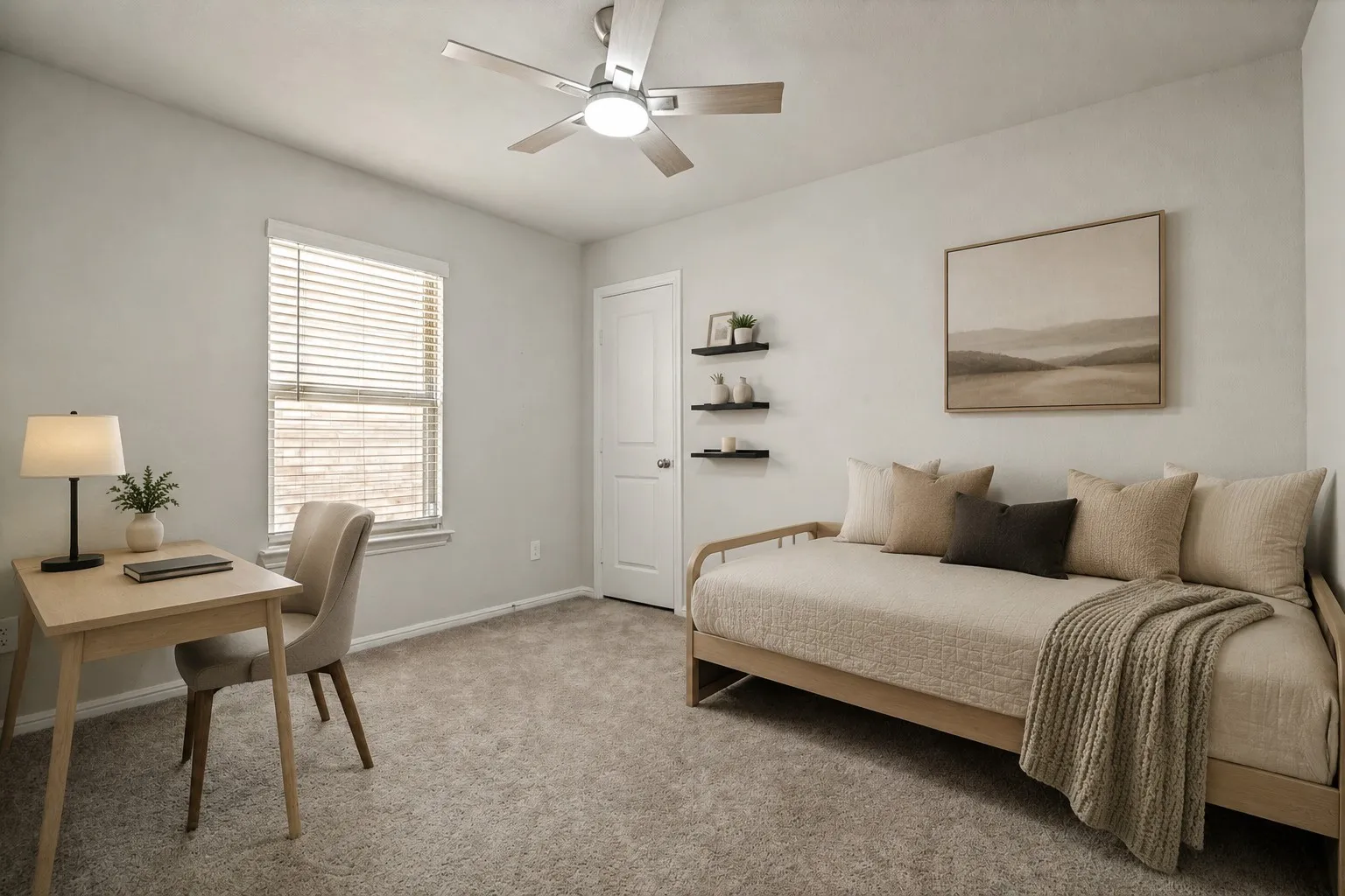 Bright bedroom retreat featuring a ceiling fan, large window with plantation shutters, neutral carpet flooring, and built-in wall shelving