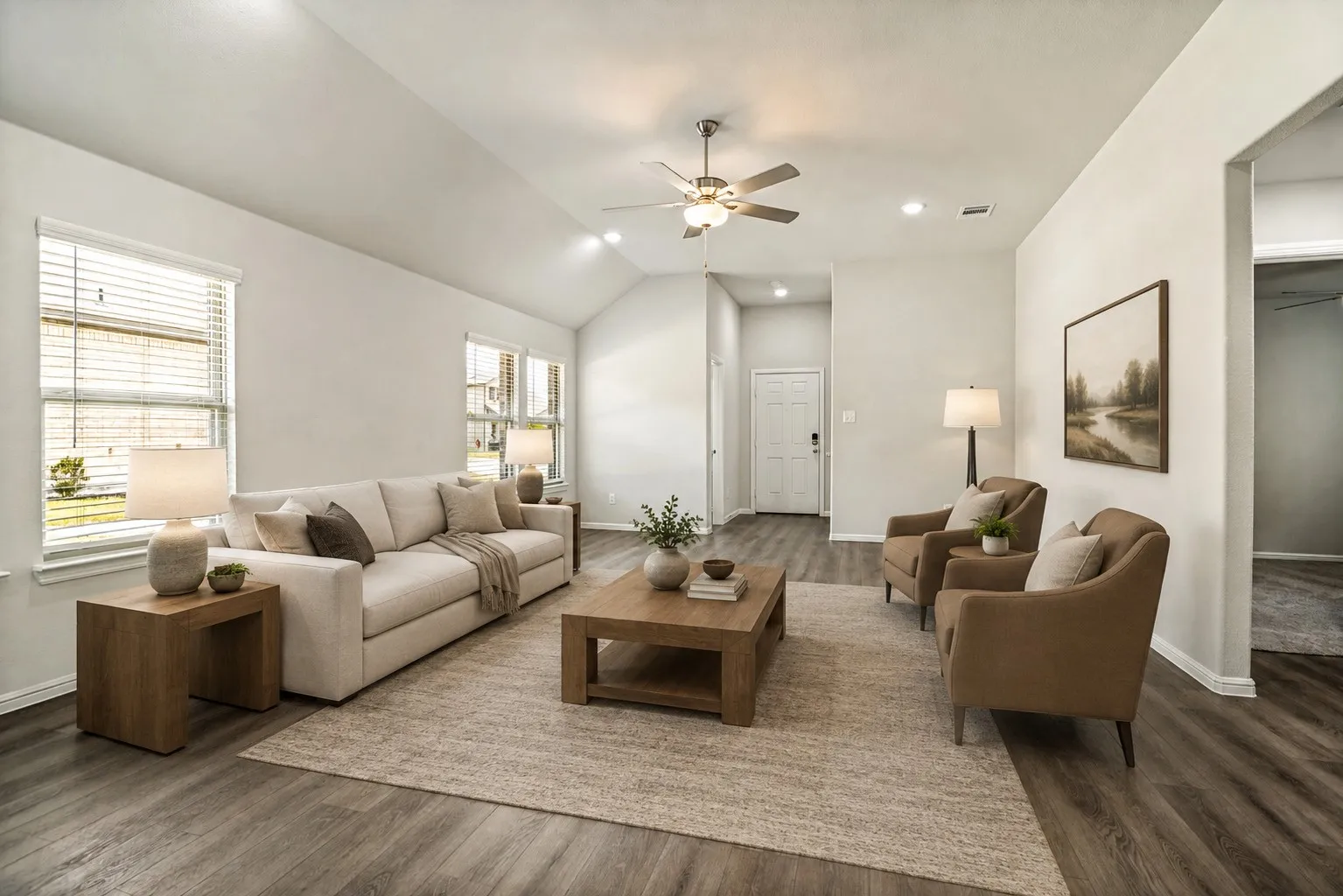 Spacious living room featuring a wood-finish plank floor, neutral wall finishes, and abundant natural light from large windows with horizontal blinds (virtually staged)