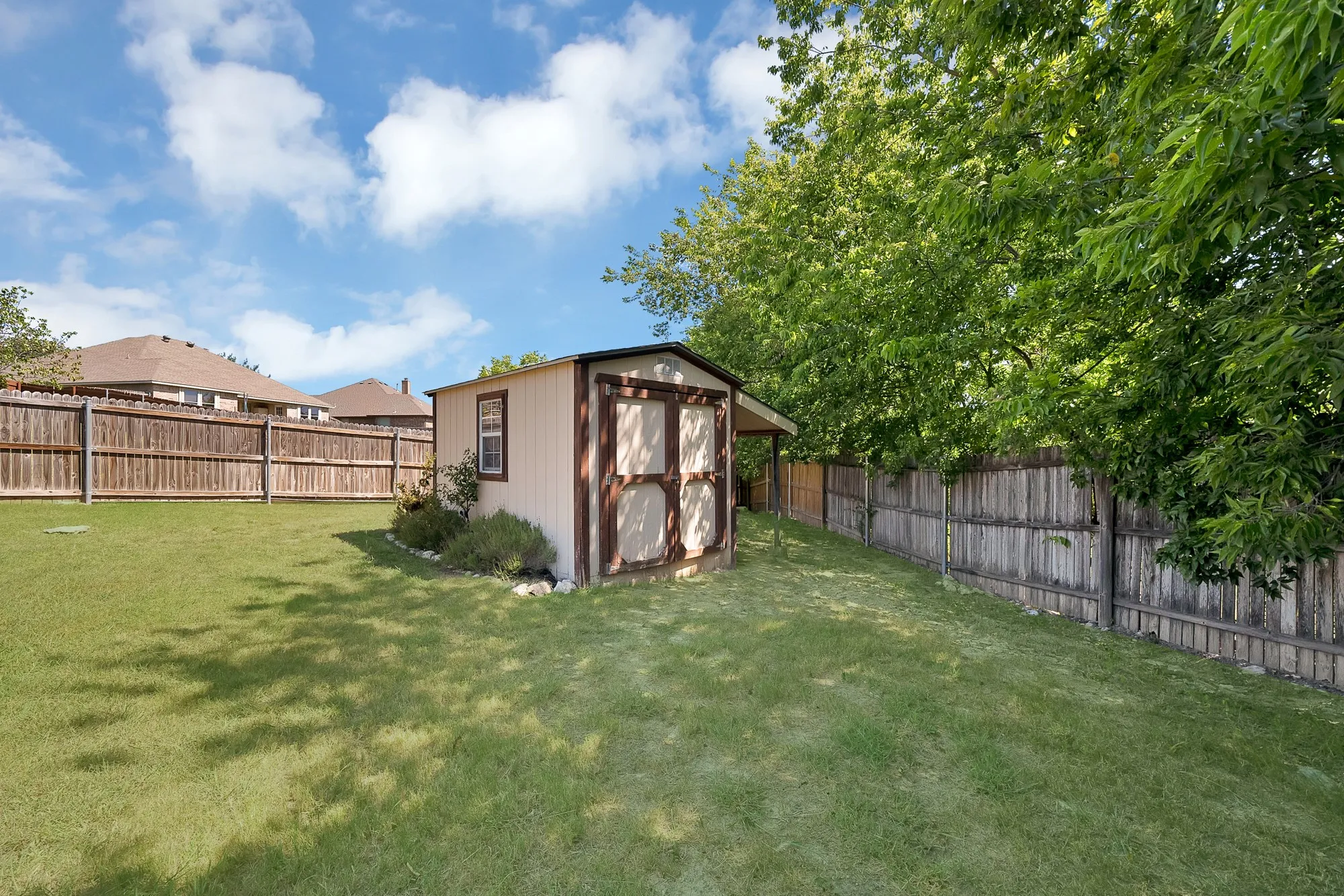 Shed in back of yard, riding lawnmower stays!