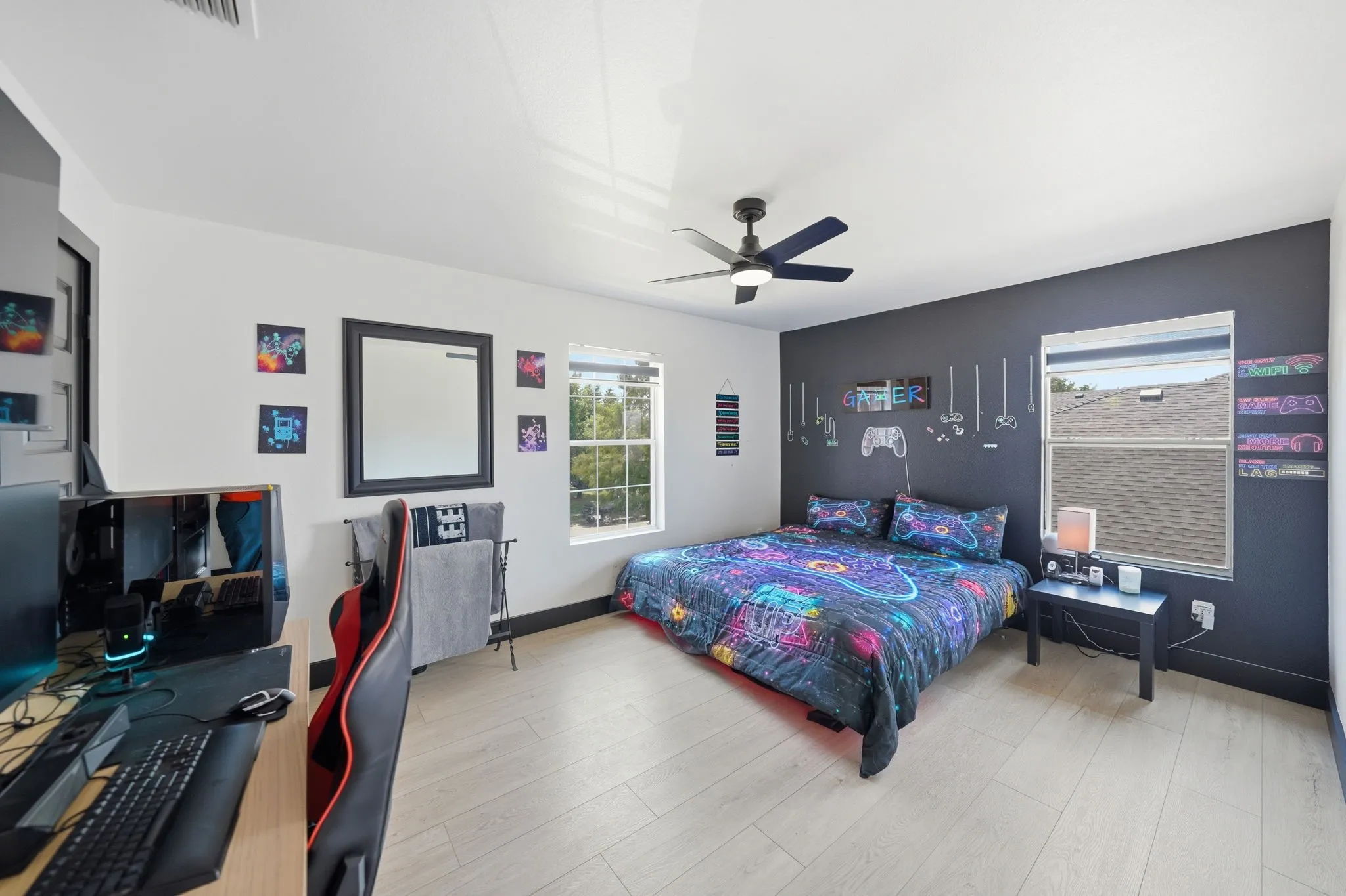 Bedroom featuring wood-finish flooring and a ceiling fan