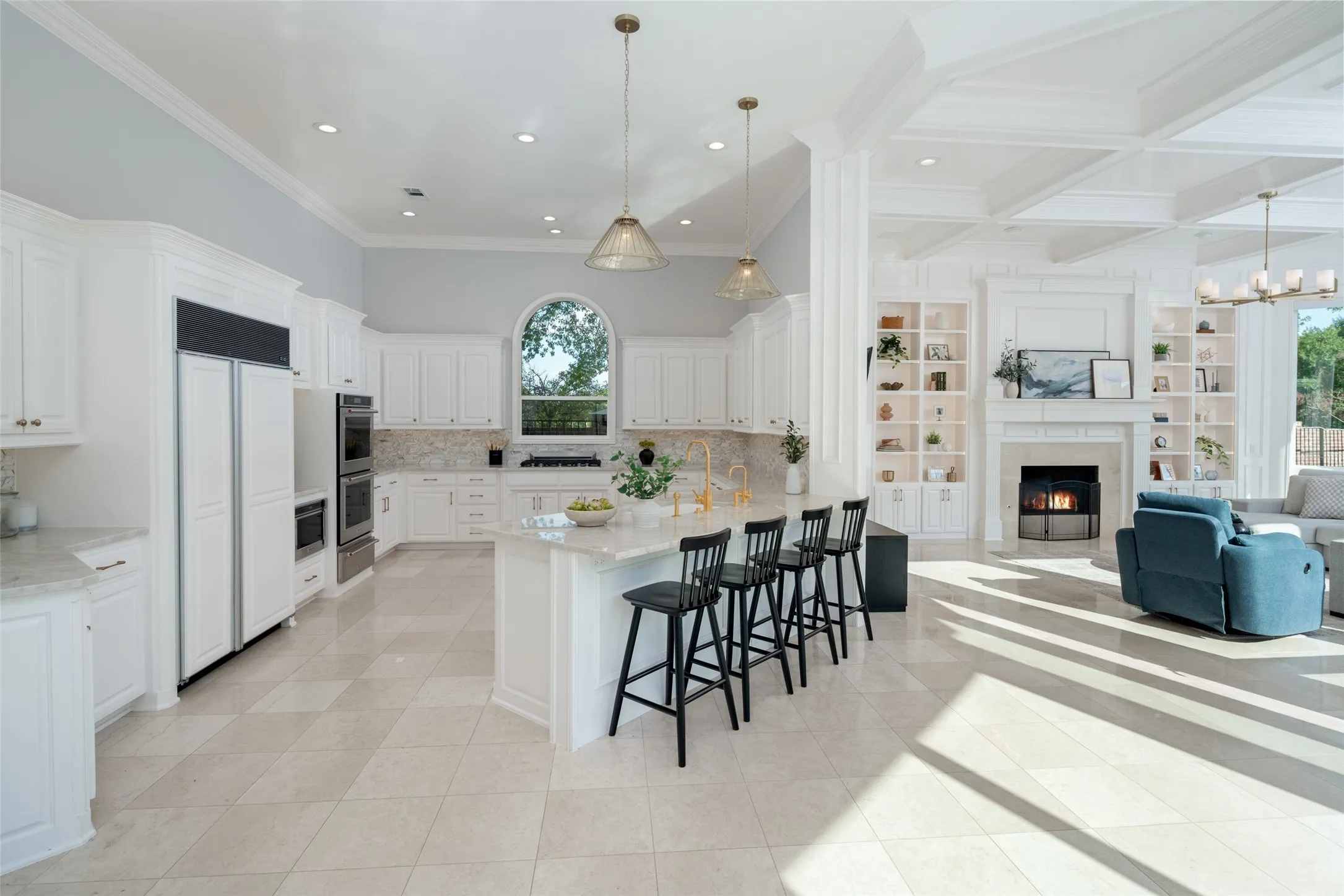 Designed for gathering, the gourmet kitchen opens seamlessly to the family room, blending elegant finishes, expansive prep space, and comfortable everyday living with exceptional views throughout.