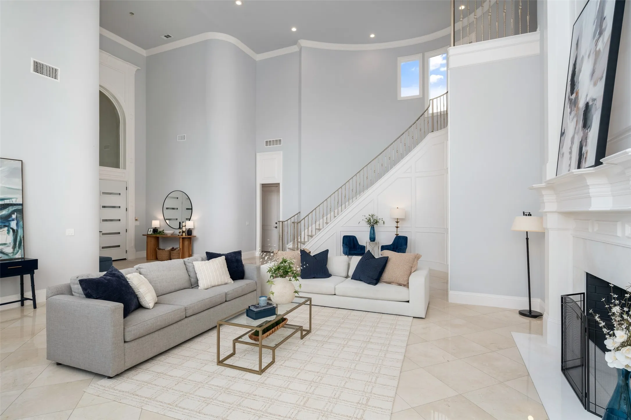 Designed for both entertaining and everyday living, the expansive family room offers incredible scale, abundant natural light, marble flooring, and an effortless connection to the outdoor living areas.