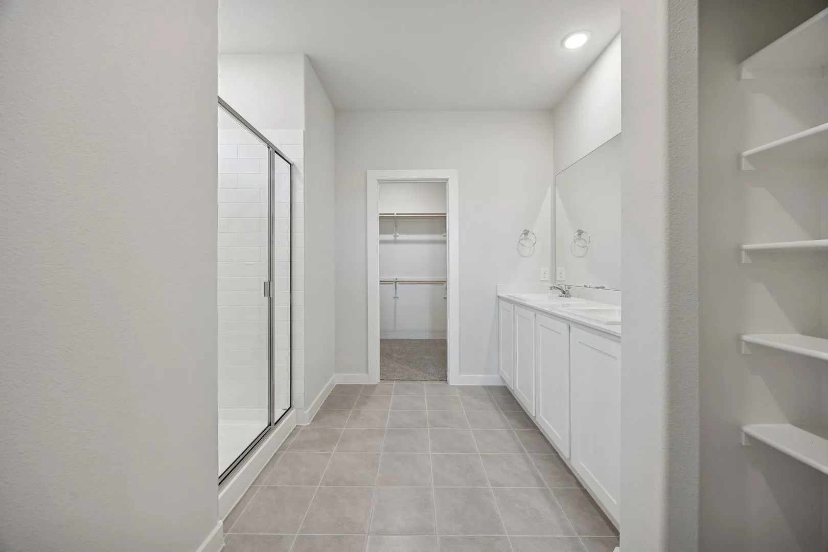 Primary Bathroom in the Oak II home plan by Trophy Signature Homes – REPRESENTATIVE PHOTO