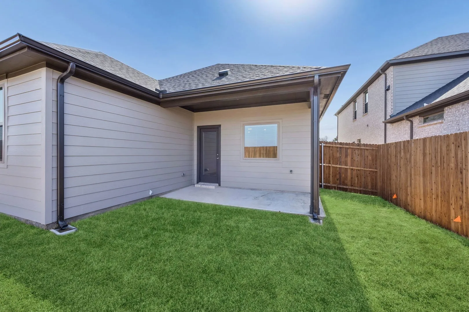 Covered Patio in the Oak II home plan by Trophy Signature Homes – REPRESENTATIVE PHOTO