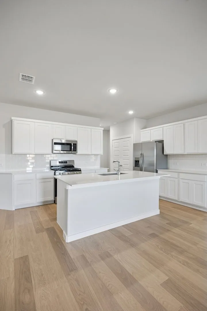 Kitchen in the Oak II home plan by Trophy Signature Homes – REPRESENTATIVE PHOTO