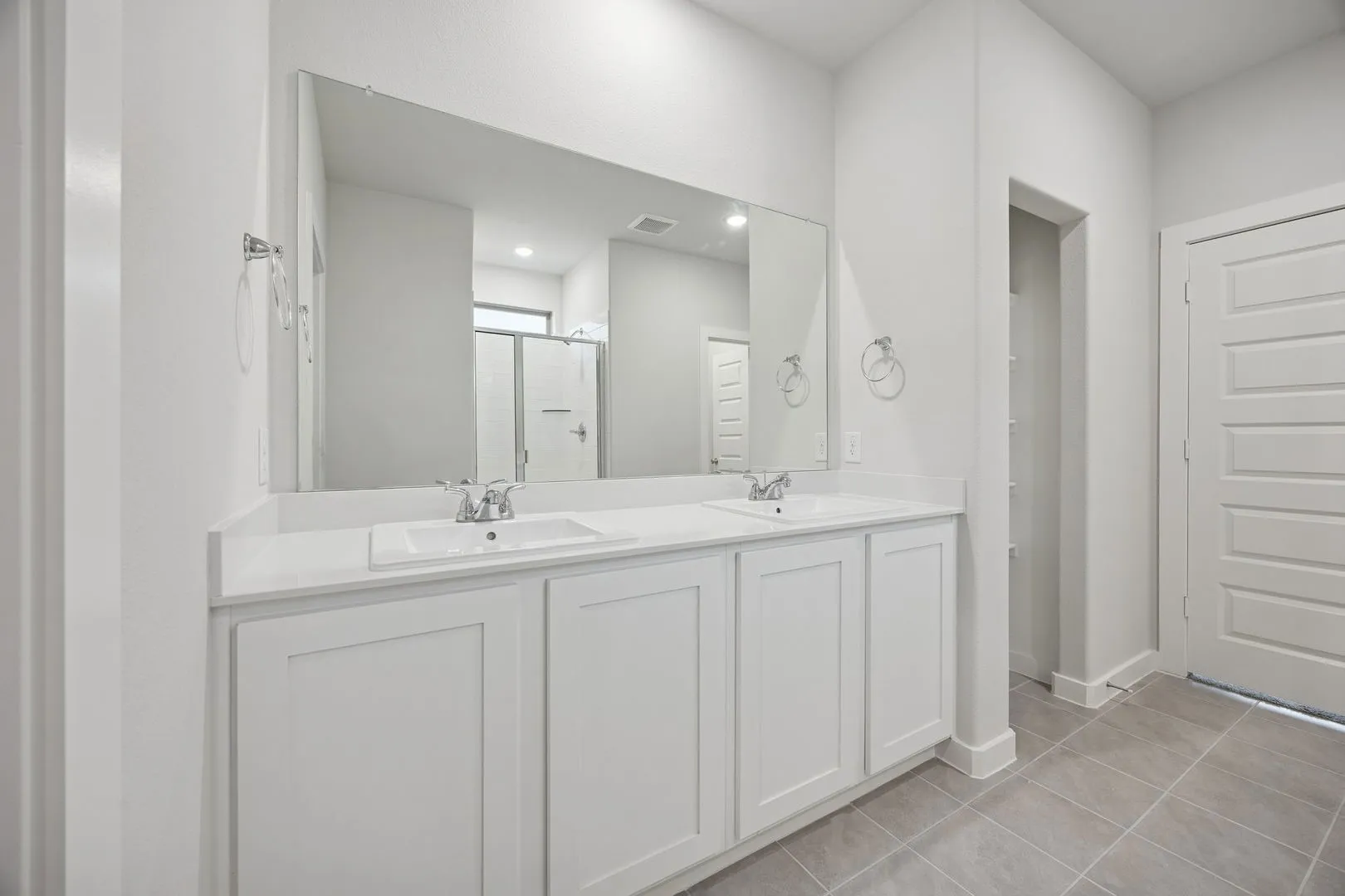 Primary Bathroom in the Oak II home plan by Trophy Signature Homes – REPRESENTATIVE PHOTO