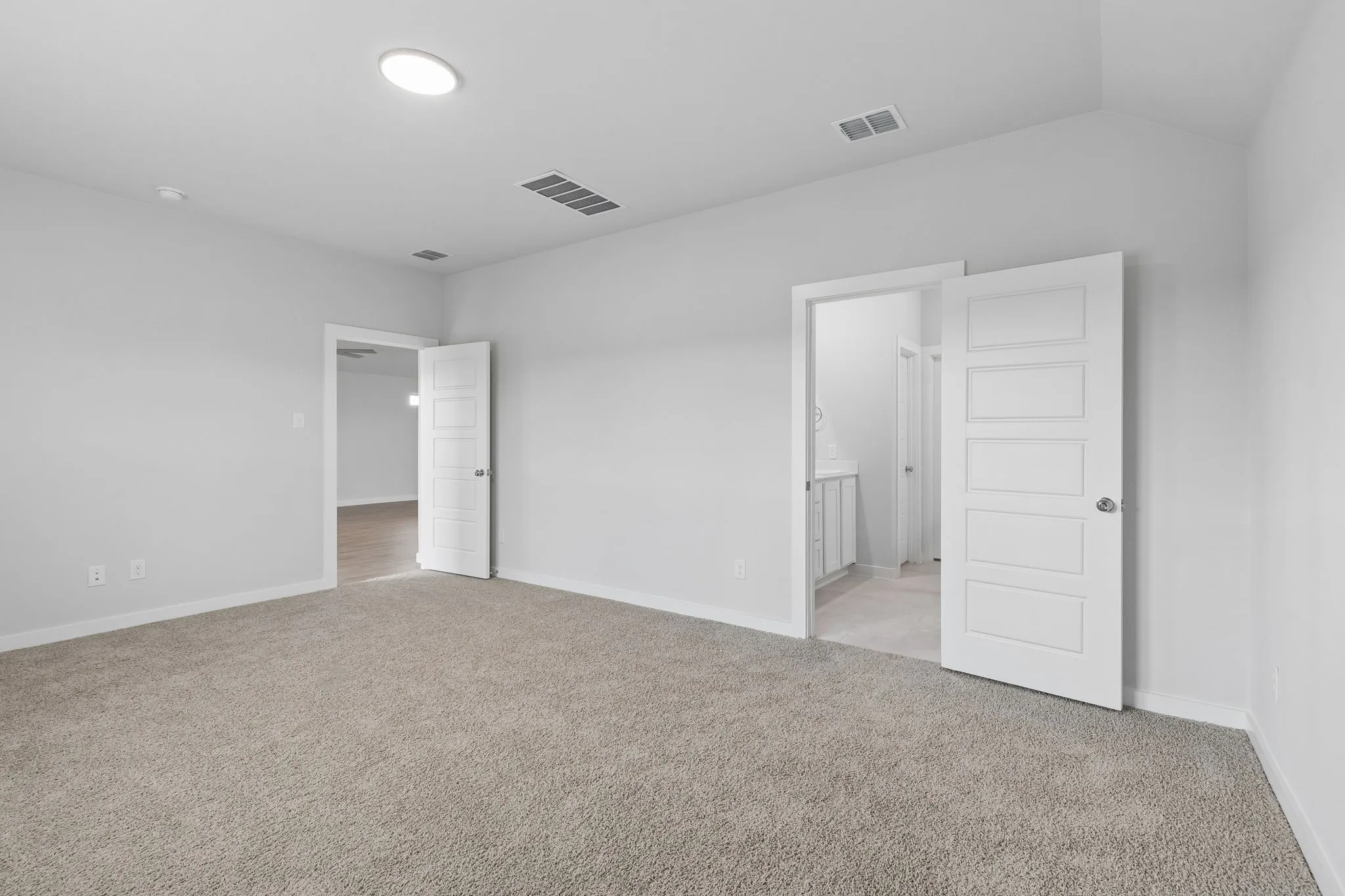 Primary Suite in the Oscar home plan by Trophy Signature Homes – REPRESENTATIVE PHOTO
