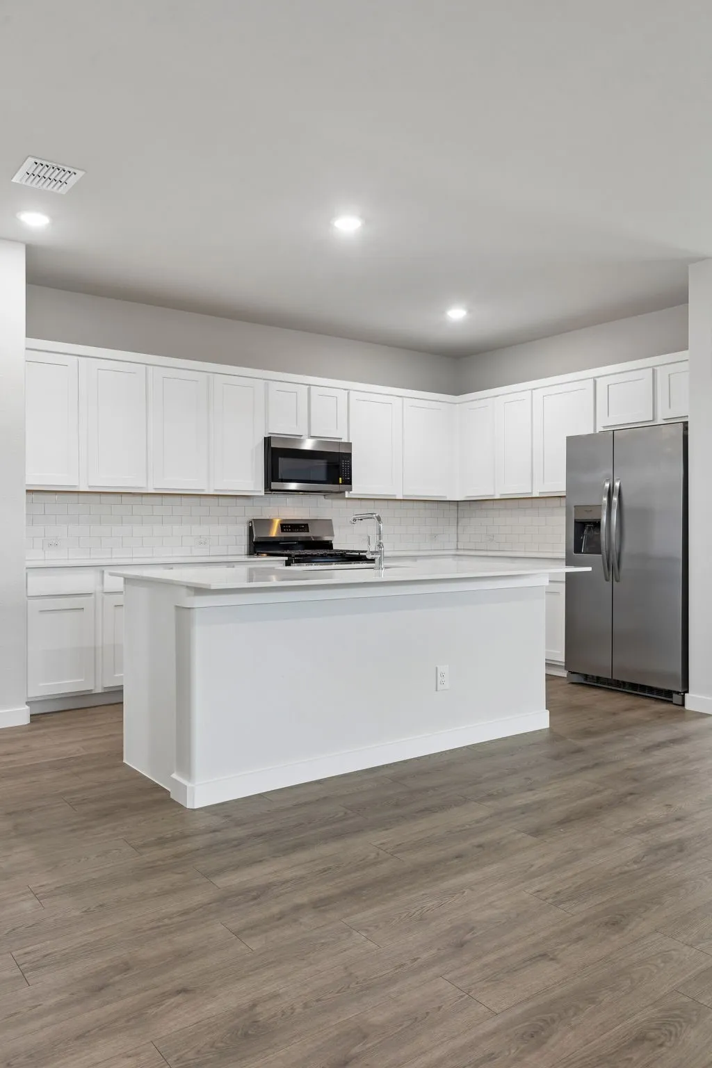 Kitchen in the Oscar home plan by Trophy Signature Homes – REPRESENTATIVE PHOTO