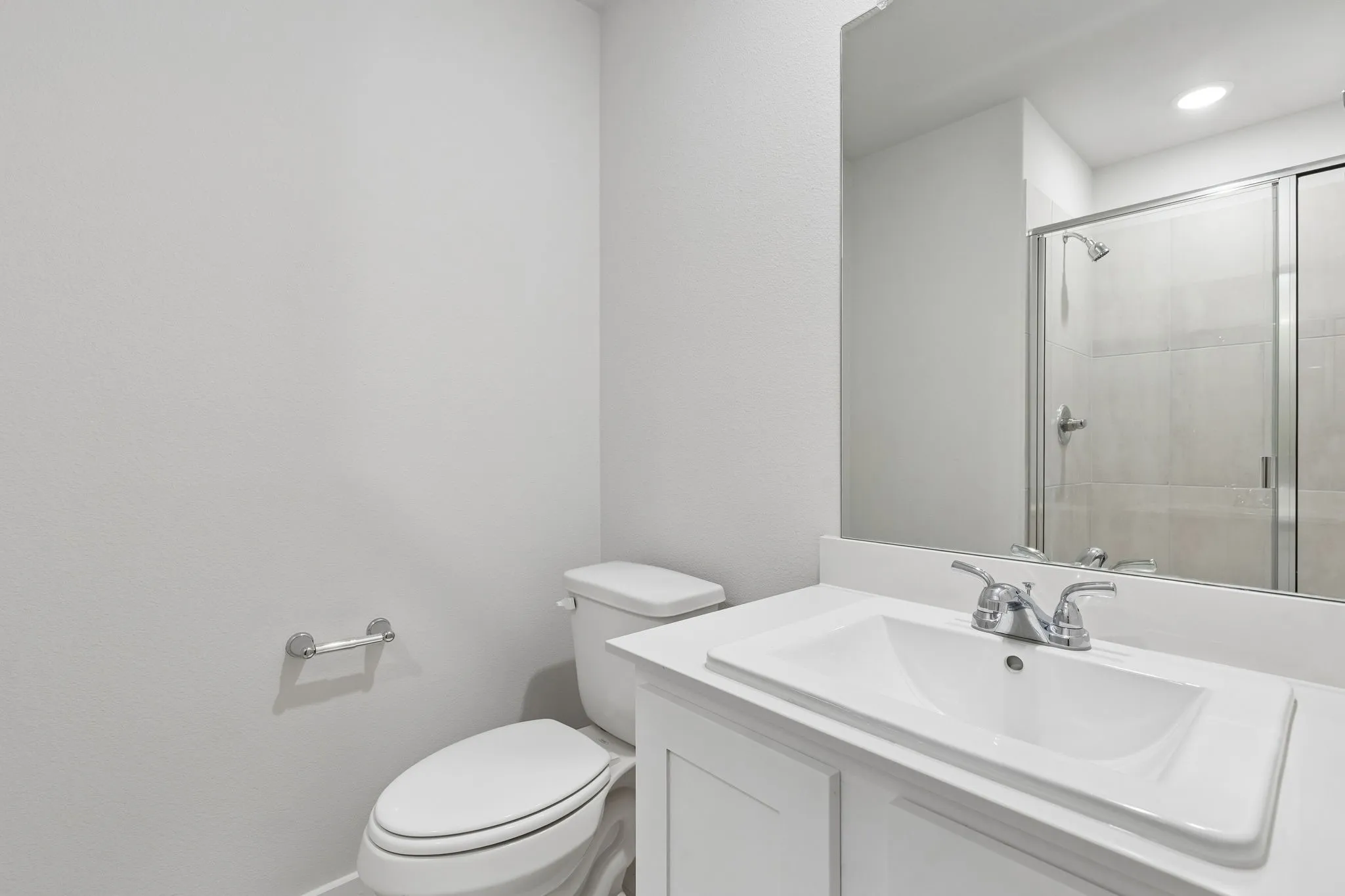 Bathroom in the Oscar home plan by Trophy Signature Homes – REPRESENTATIVE PHOTO