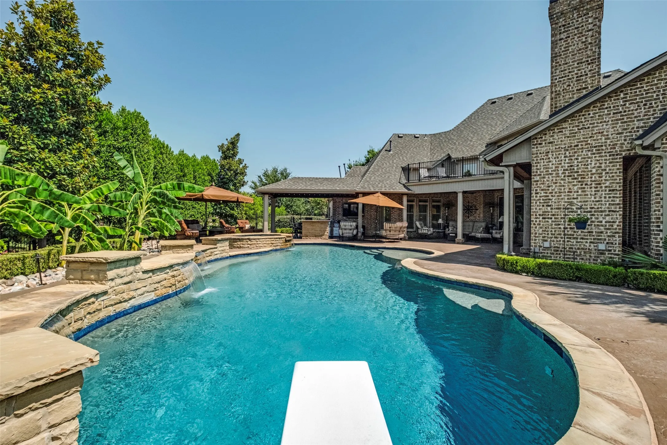 Heated swimming pool with a diving board