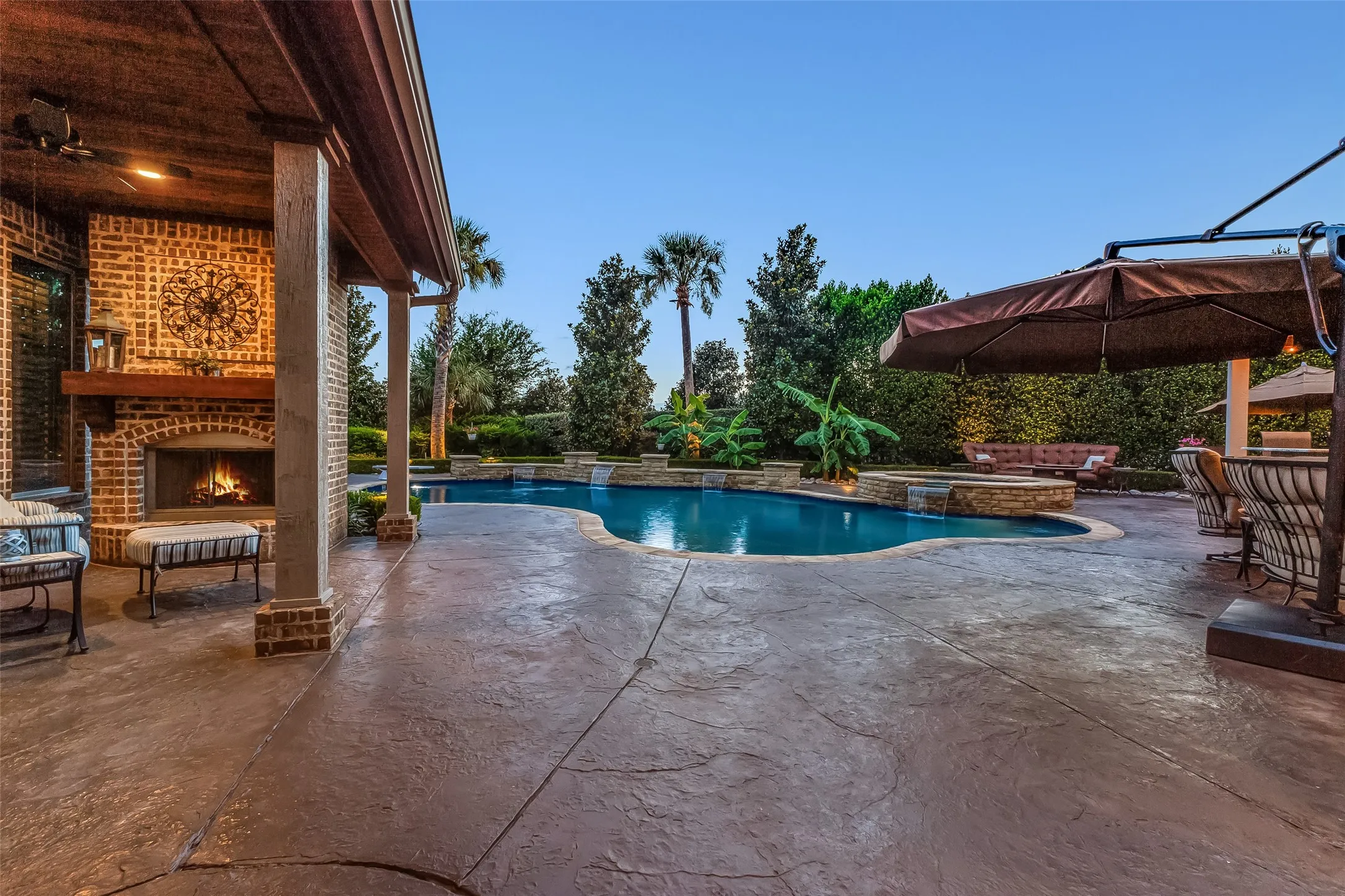 Beautiful fireplace seating area adjacent to the pool.