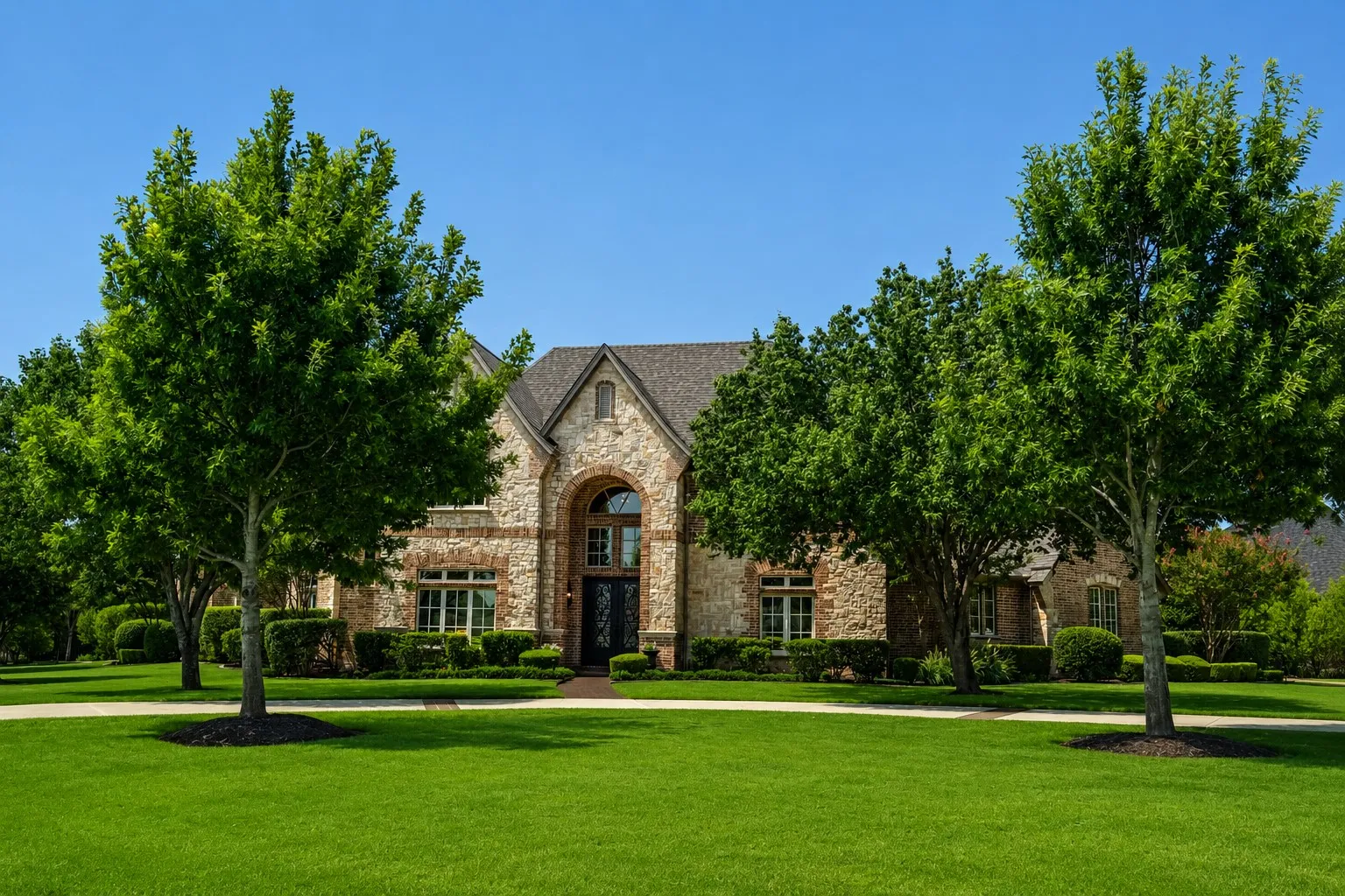 Stone and brick facade with an arched entry