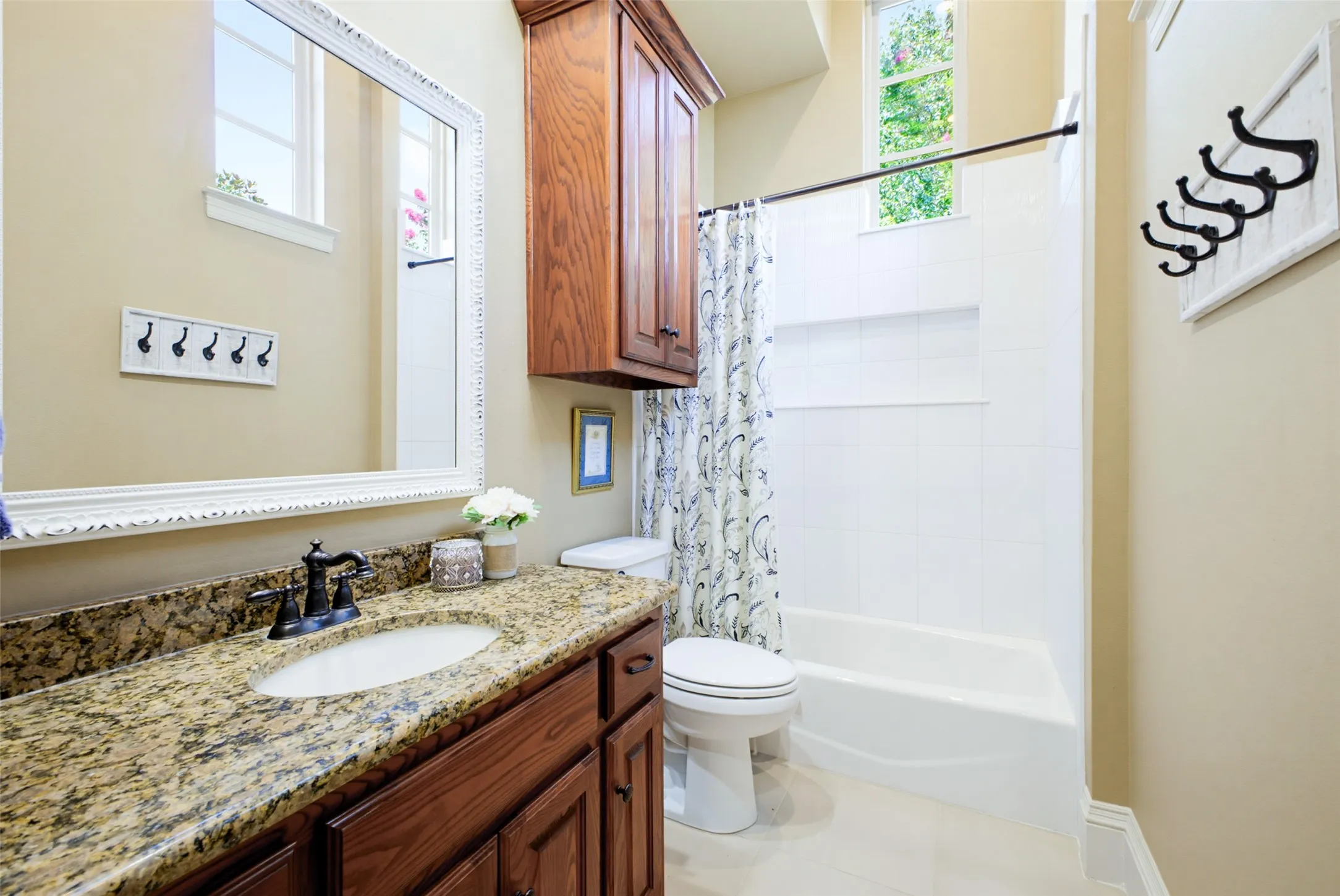 Downstairs guest suite bathroom with tall ceilings and a tub.