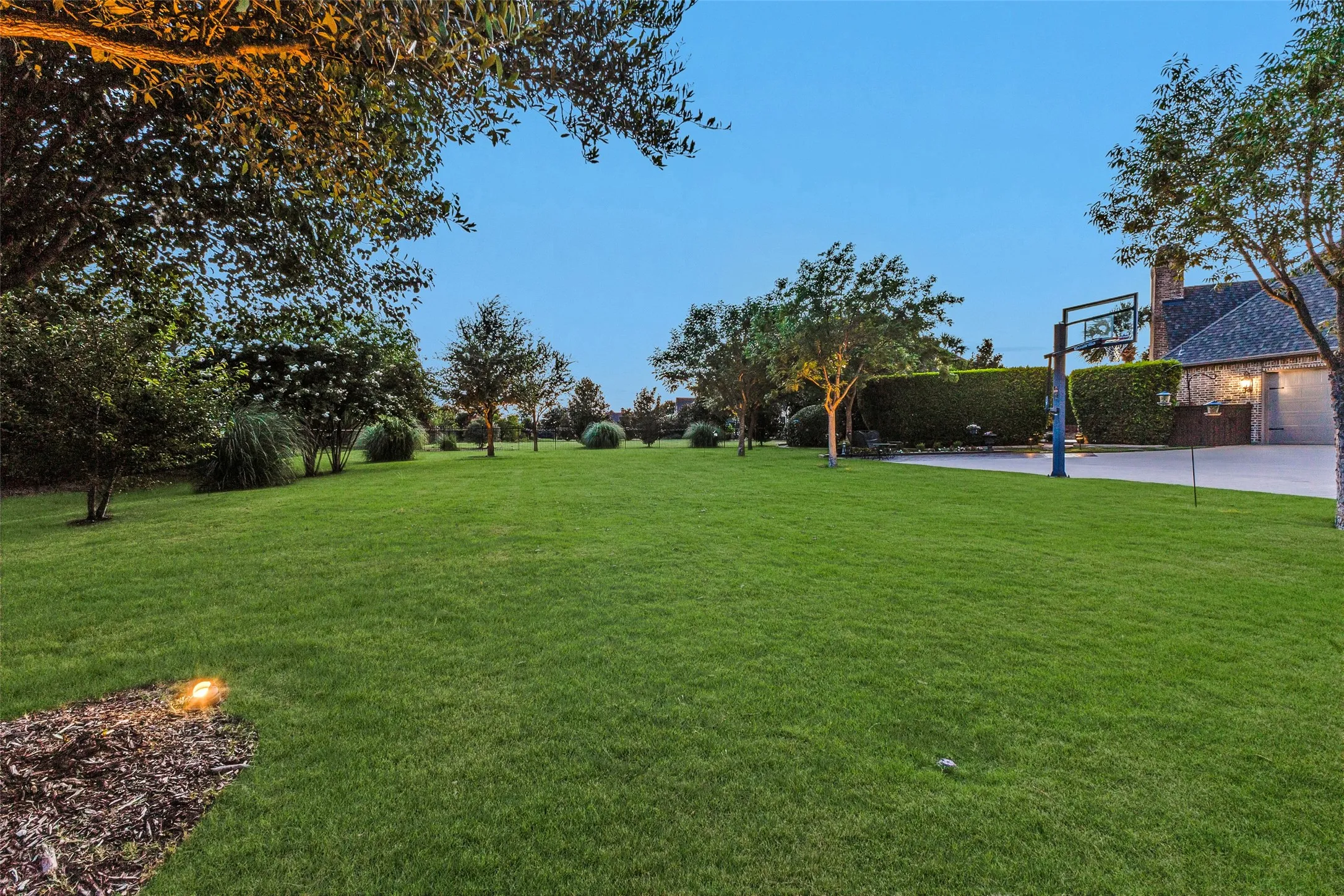 Huge grass area for play on this 1.08 acre lot.