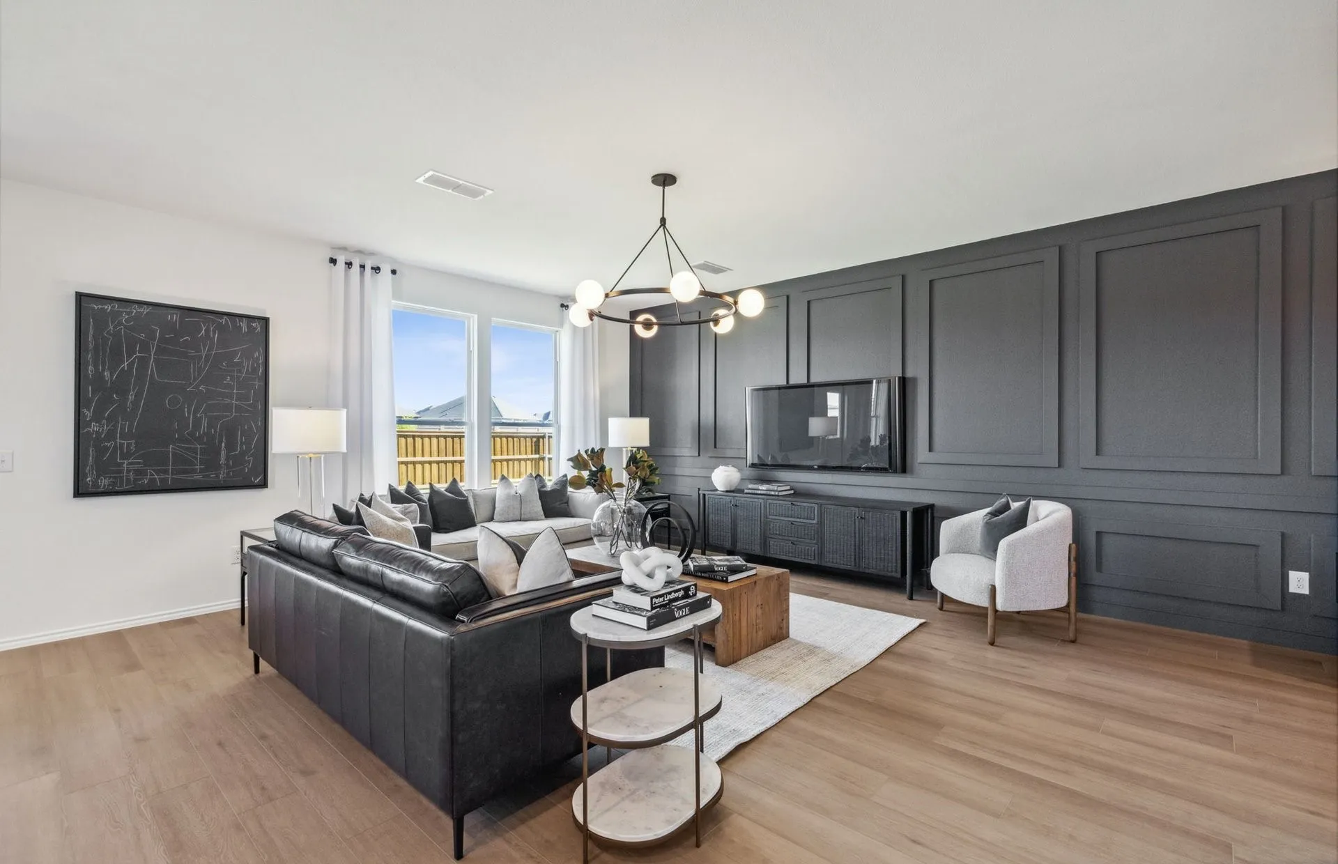 *Model Representation - Spacious gathering room with large windows