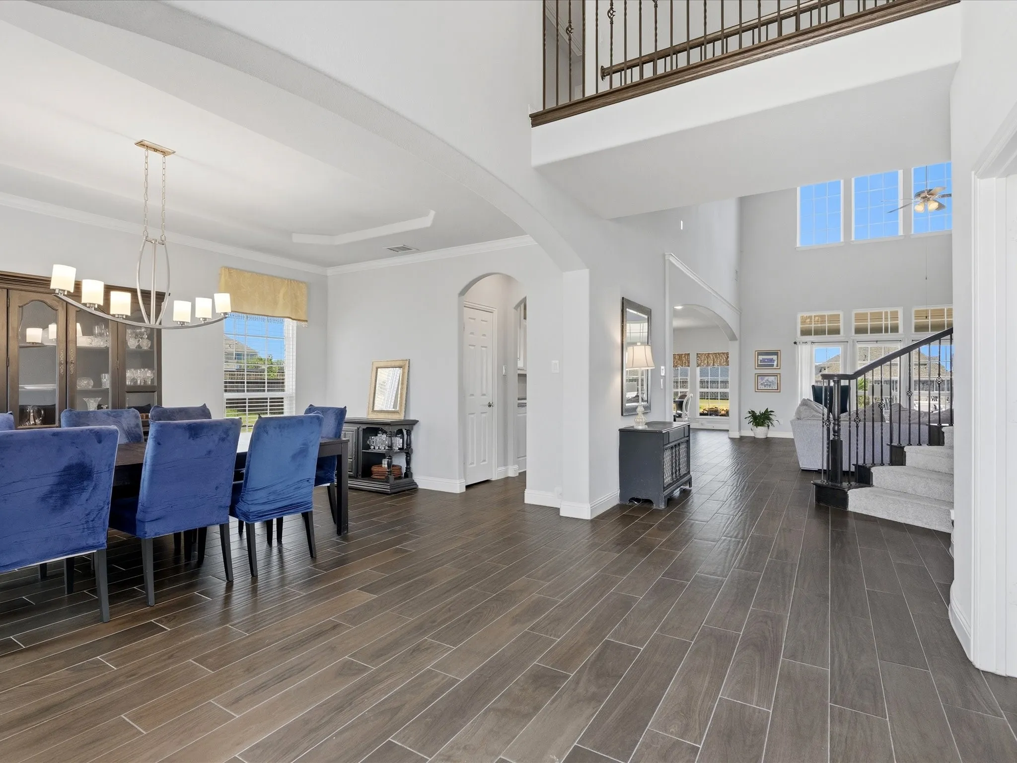 Entry into home with vaulted ceiling, spacious dining room to the left and office with front window, solid wood french doors and large closet.
