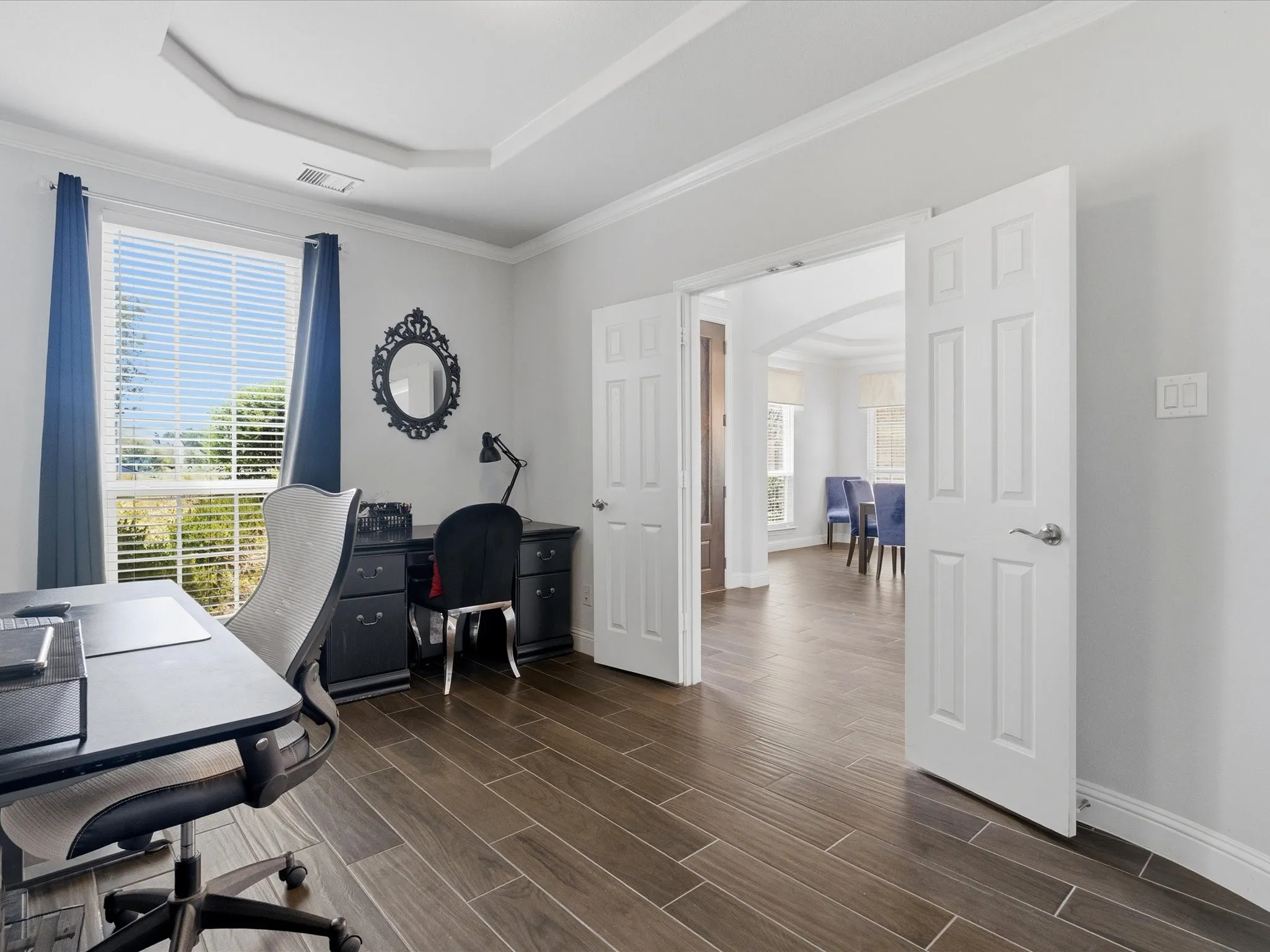Office features wood french doors, view of culdesac and large closet