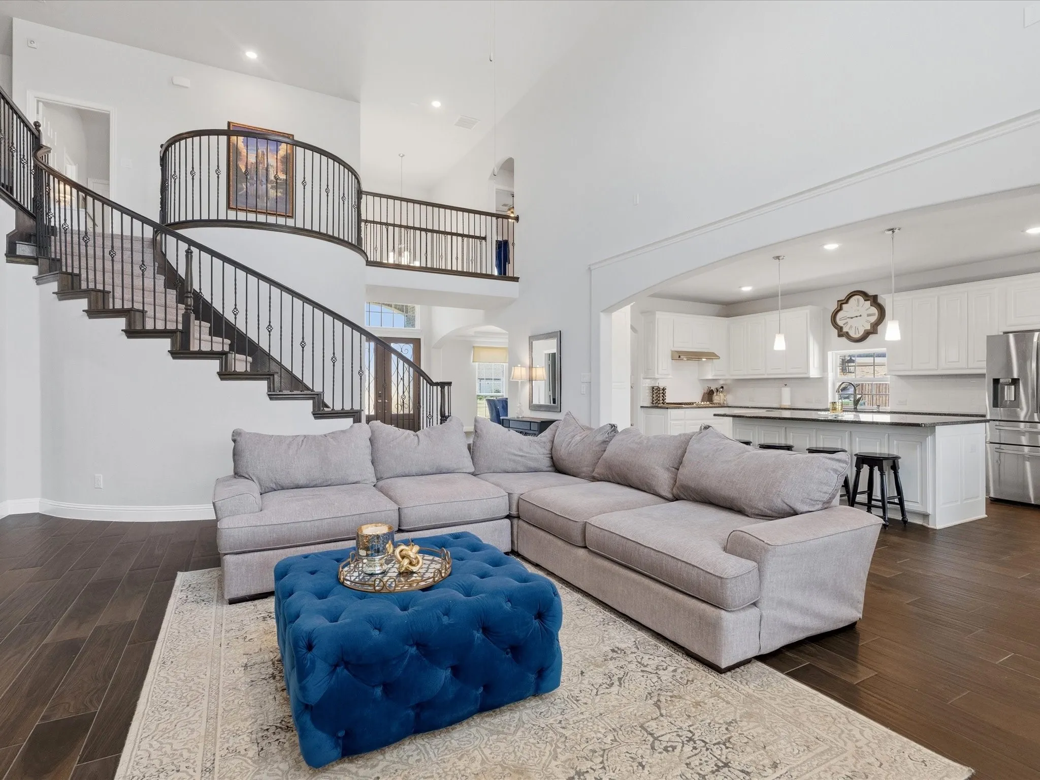 Winding staircase leads to game room, media room, 4 additional bedrooms and 3.5 bathrooms