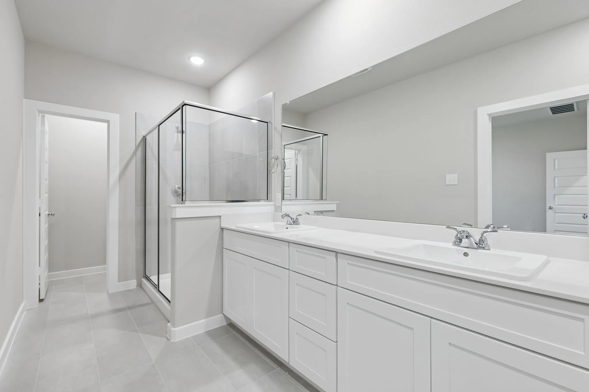 Primary Bathroom in the Holden home plan by Trophy Signature Homes – REPRESENTATIVE PHOTO