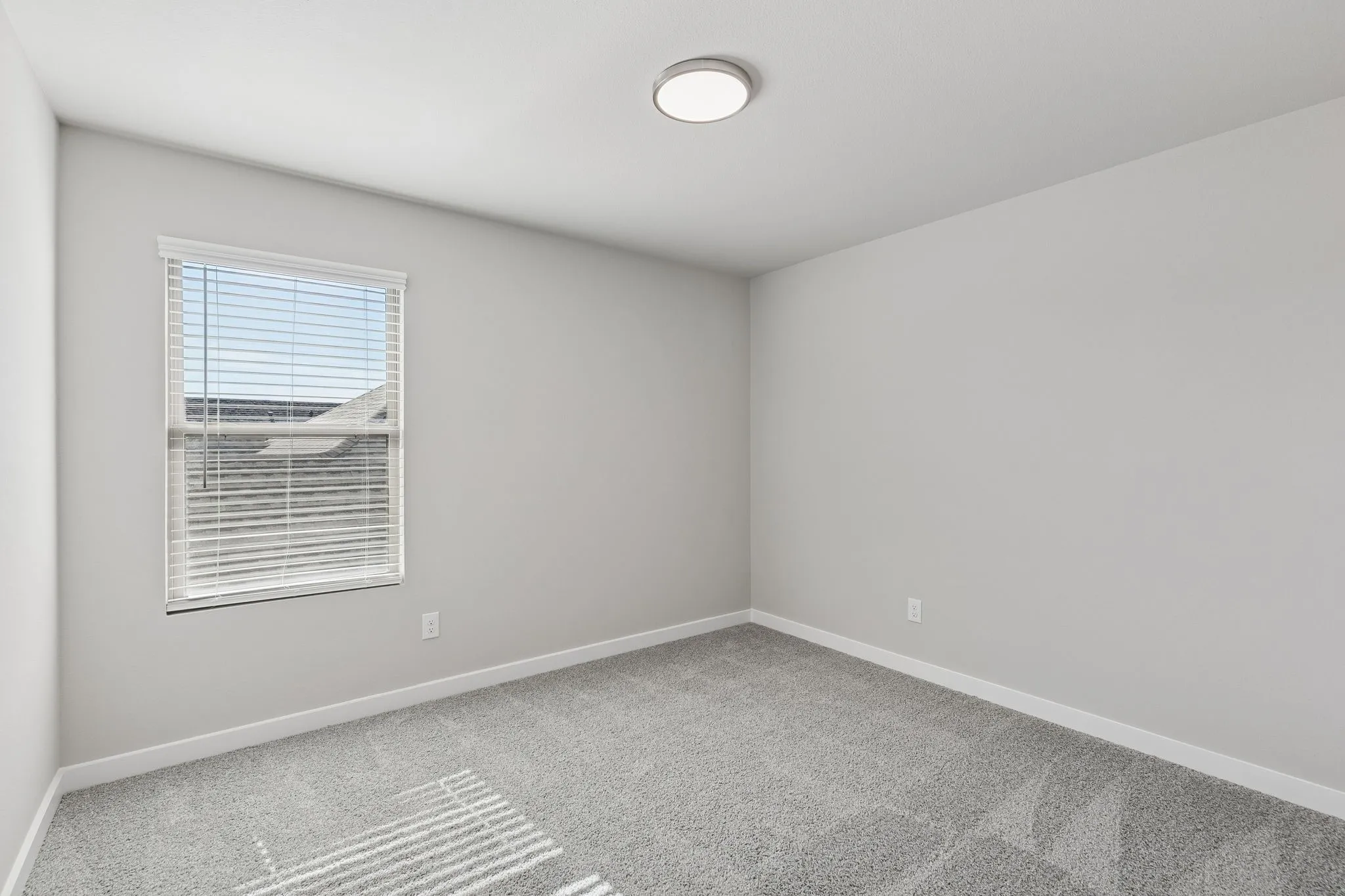Bedroom in the Holden home plan by Trophy Signature Homes – REPRESENTATIVE PHOTO