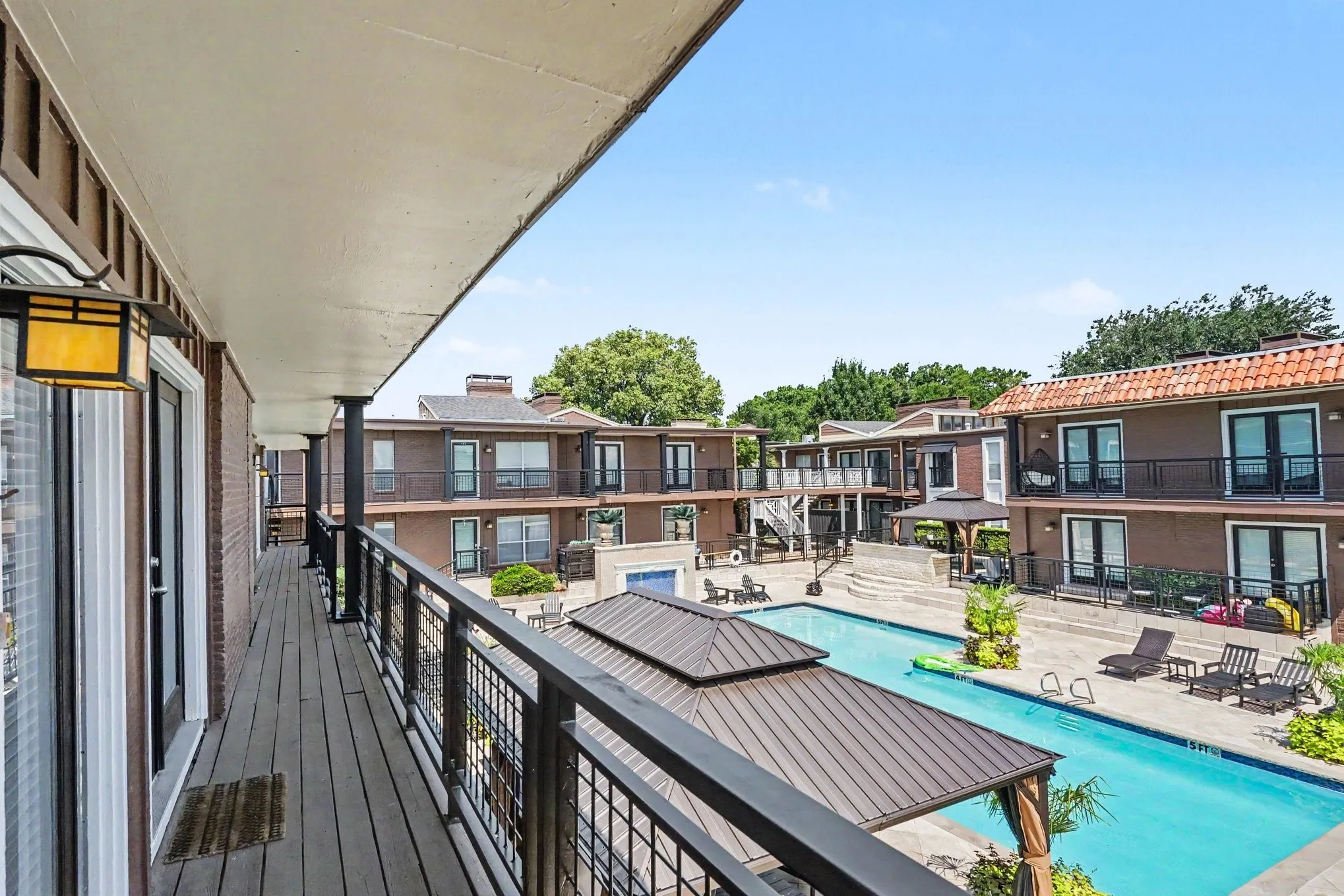 The front door balcony offers an amazing view of the resort-style Tuscany Pool.