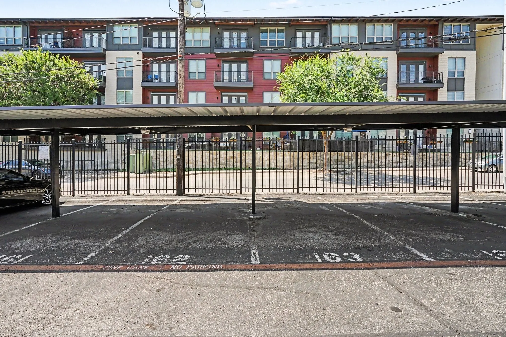Covered parking spaces 162 and 163 are assigned to this unit.