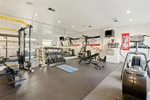 There is even an on-site fitness room with weights, a squat rack, full dumbbells, plus an elliptical trainer and treadmill