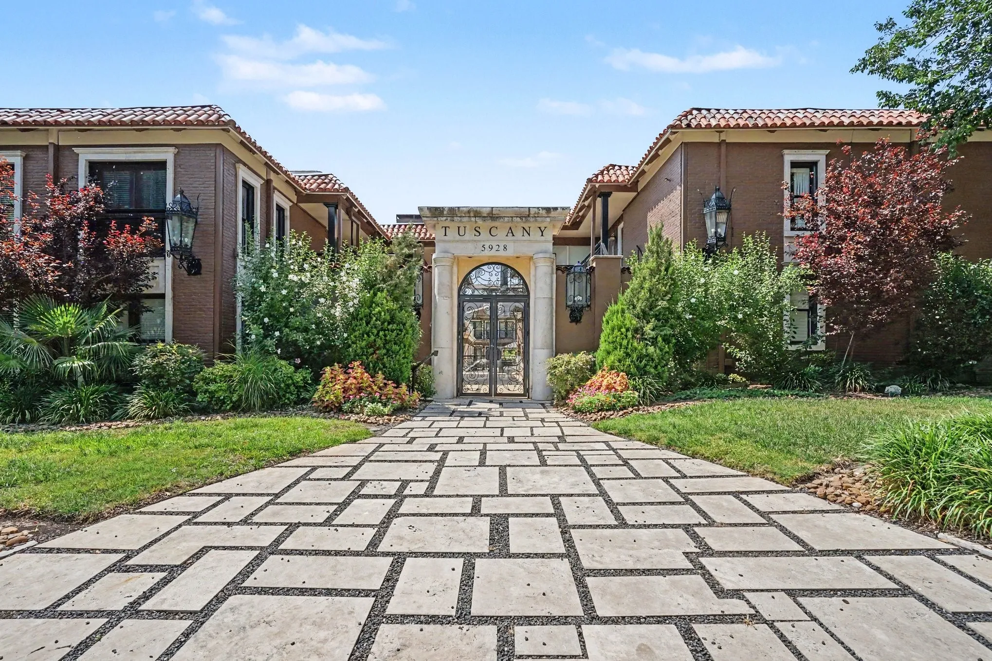 Front entrance to perfectly located Tuscany Condos.  Close to SMU, three grocery stores including Central Market, University Crossing Trail which connects to White Rock Lake and Uptown via the Katy Trail.