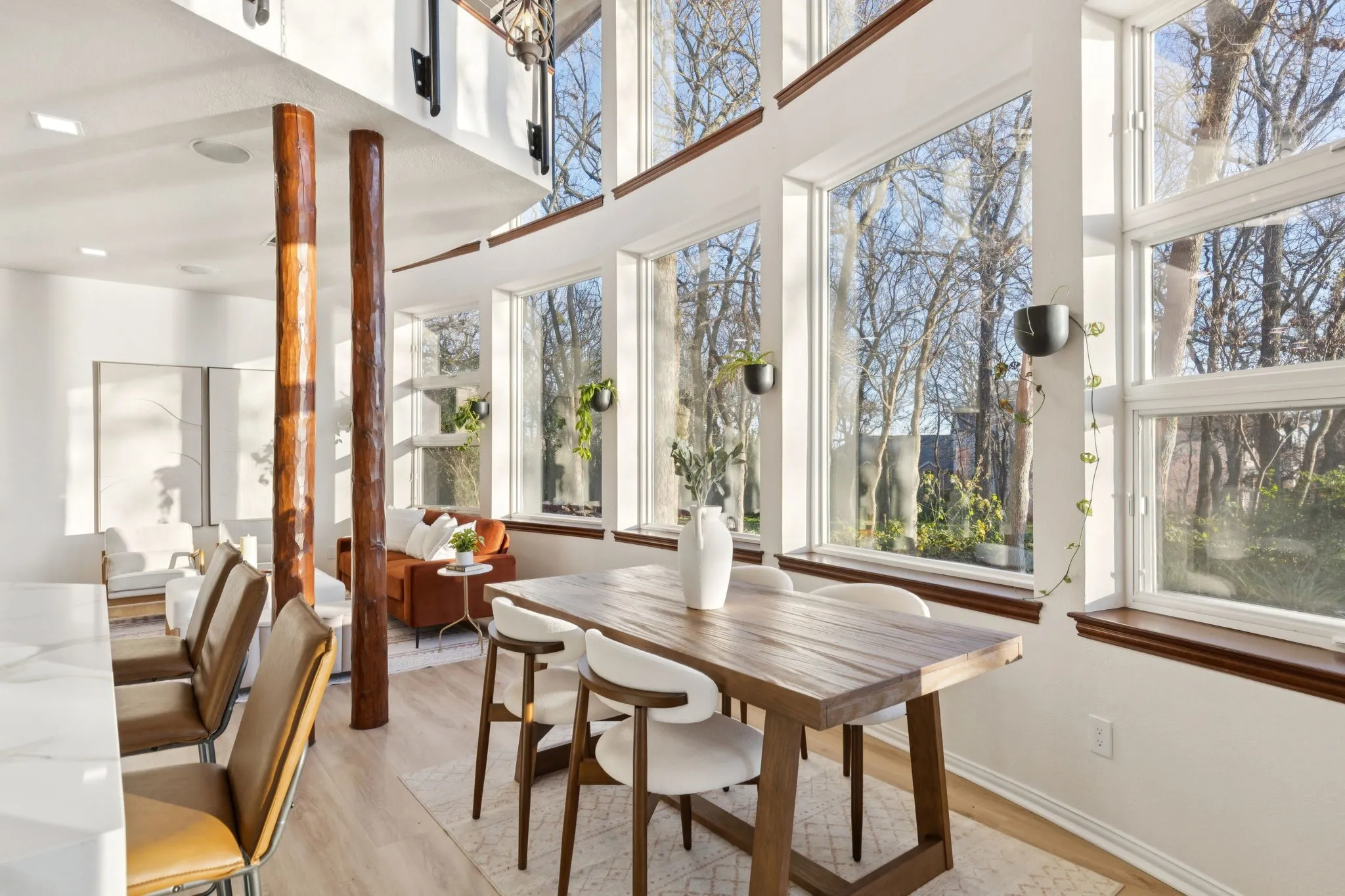 Sunroom / solarium featuring wood finished floors and baseboards