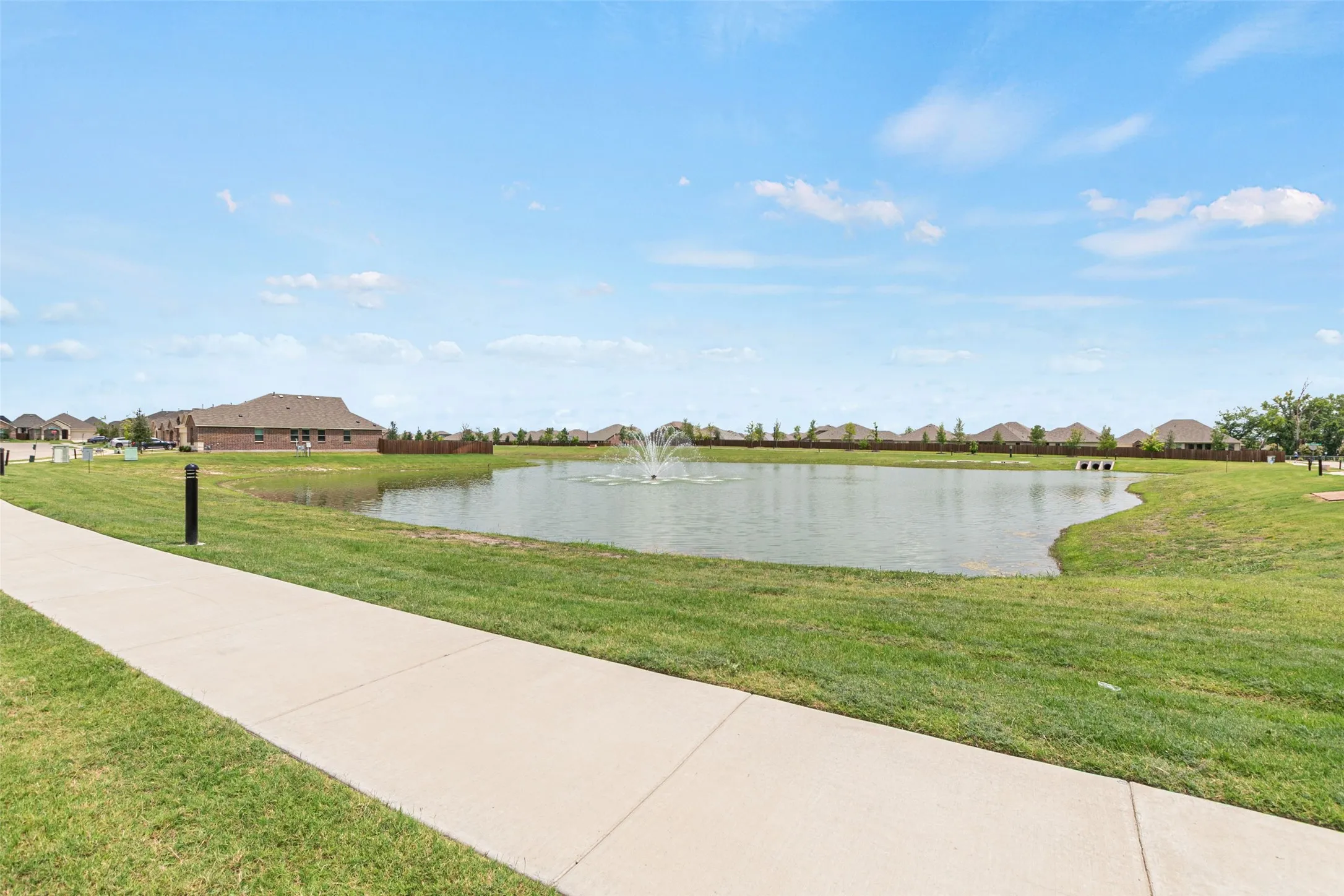 Step out of the front door onto hiking and biking trails surrounding a pond with a fountain.