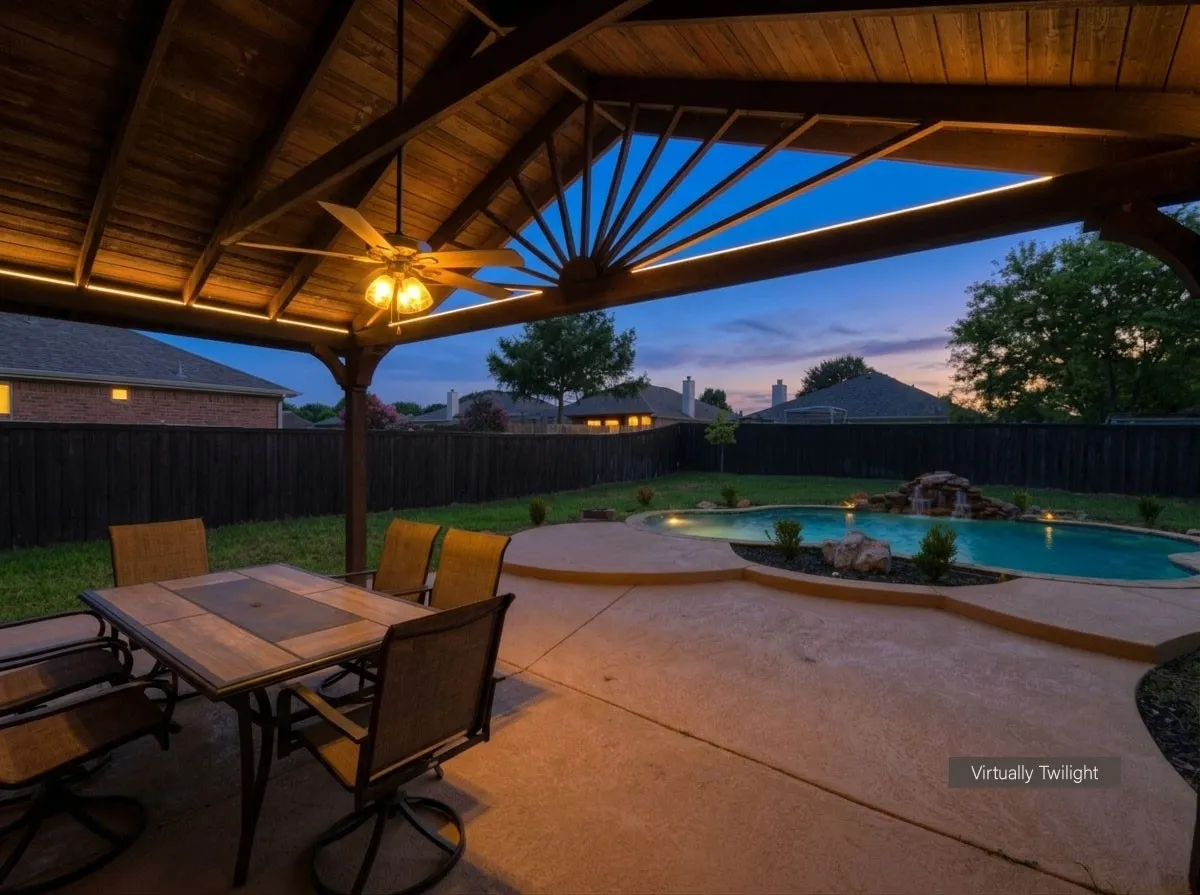 Covered patio featuring a wood-plank ceiling with integrated lighting and a ceiling fan