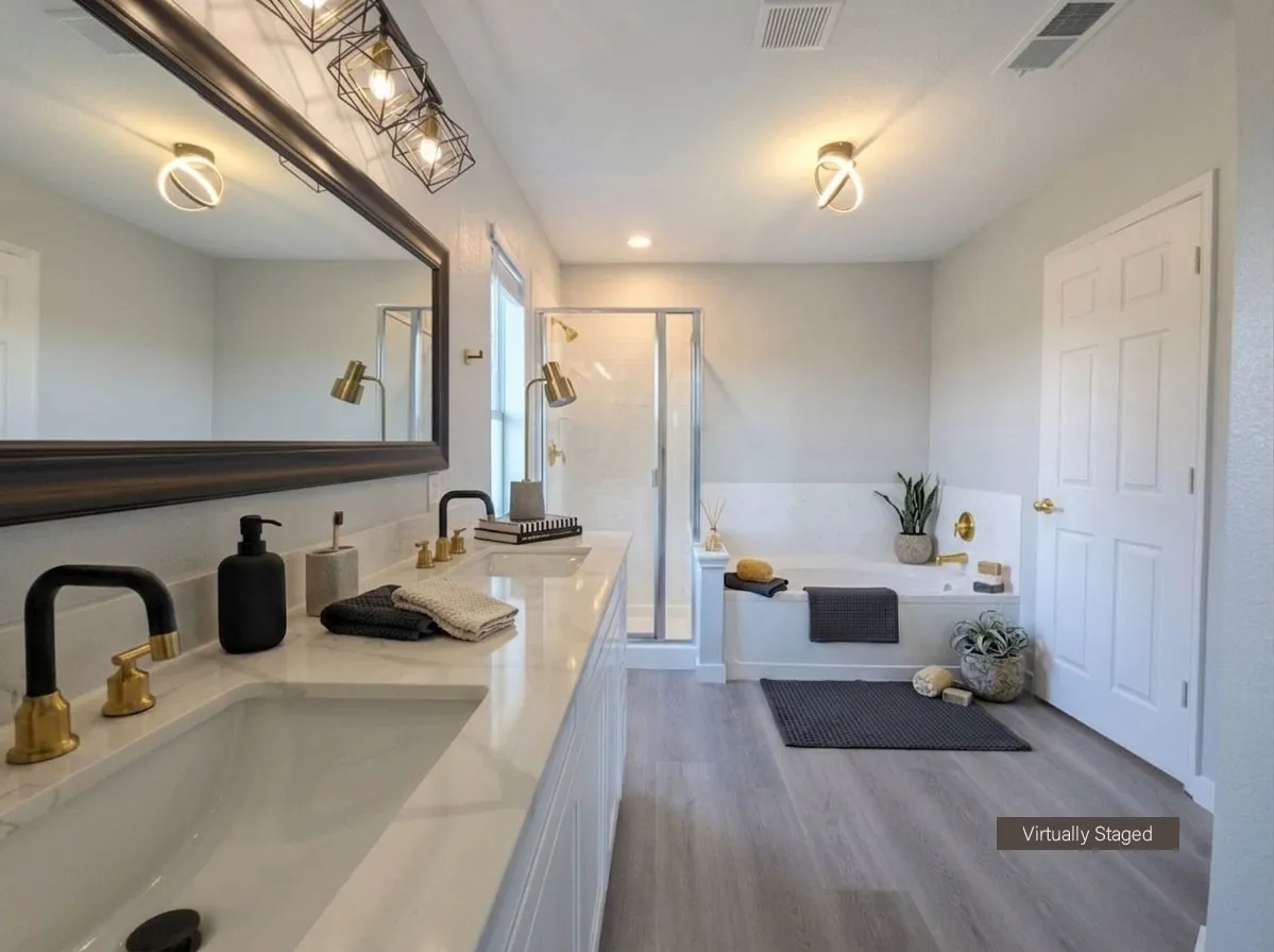 Dual vanity featuring integrated sinks, matte black and gold-finish faucets, and a white marble-look countertop