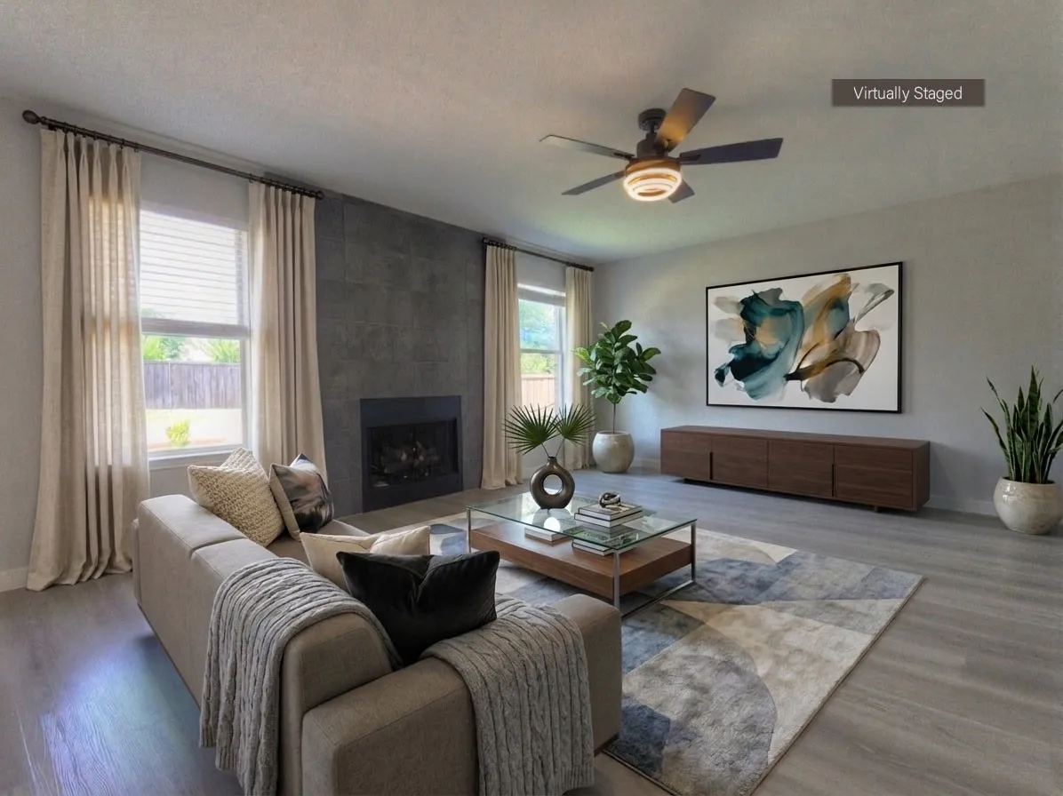 Living area featuring a textured gray accent wall with an integrated fireplace, wood-finish flooring, and recessed lighting