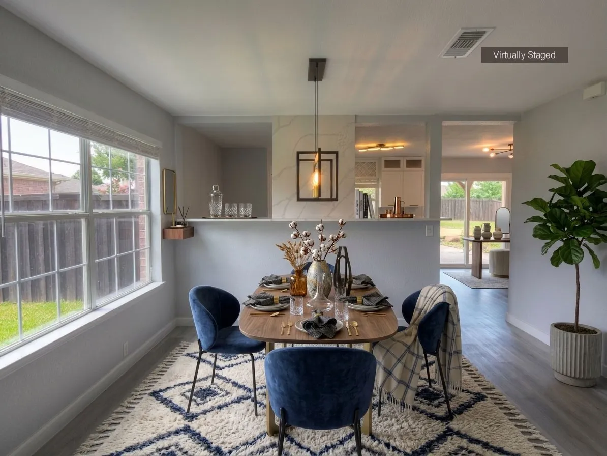 Dining area with wood-finish flooring and a contemporary linear pendant light fixture