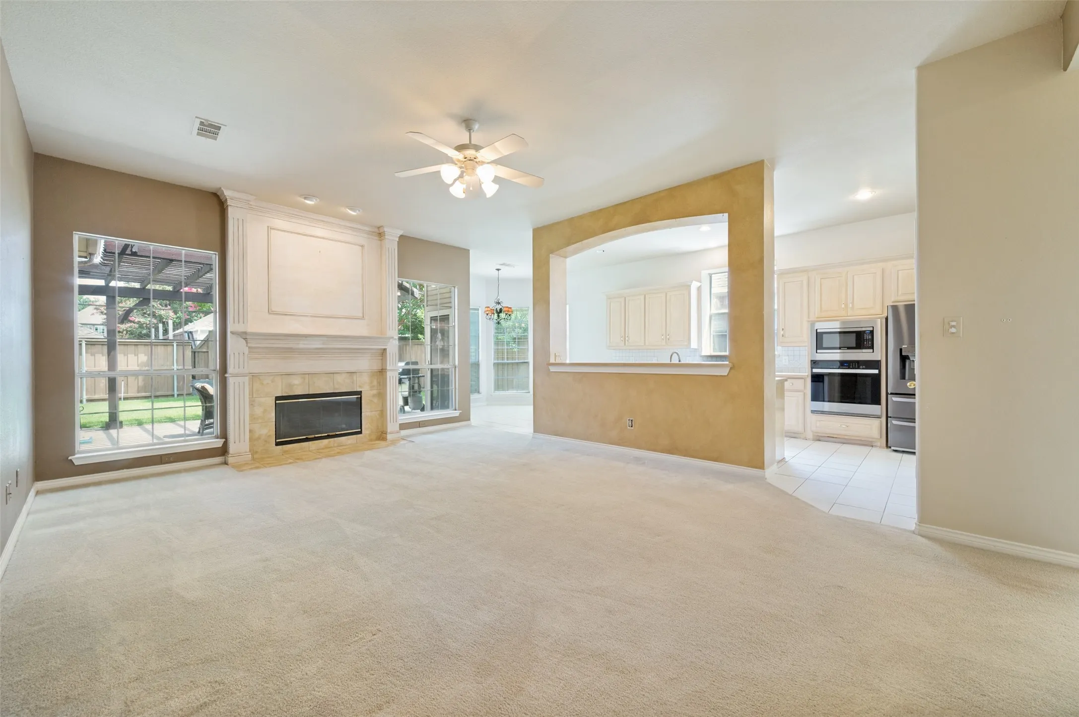 Family room with fireplace and open to the kitchen.