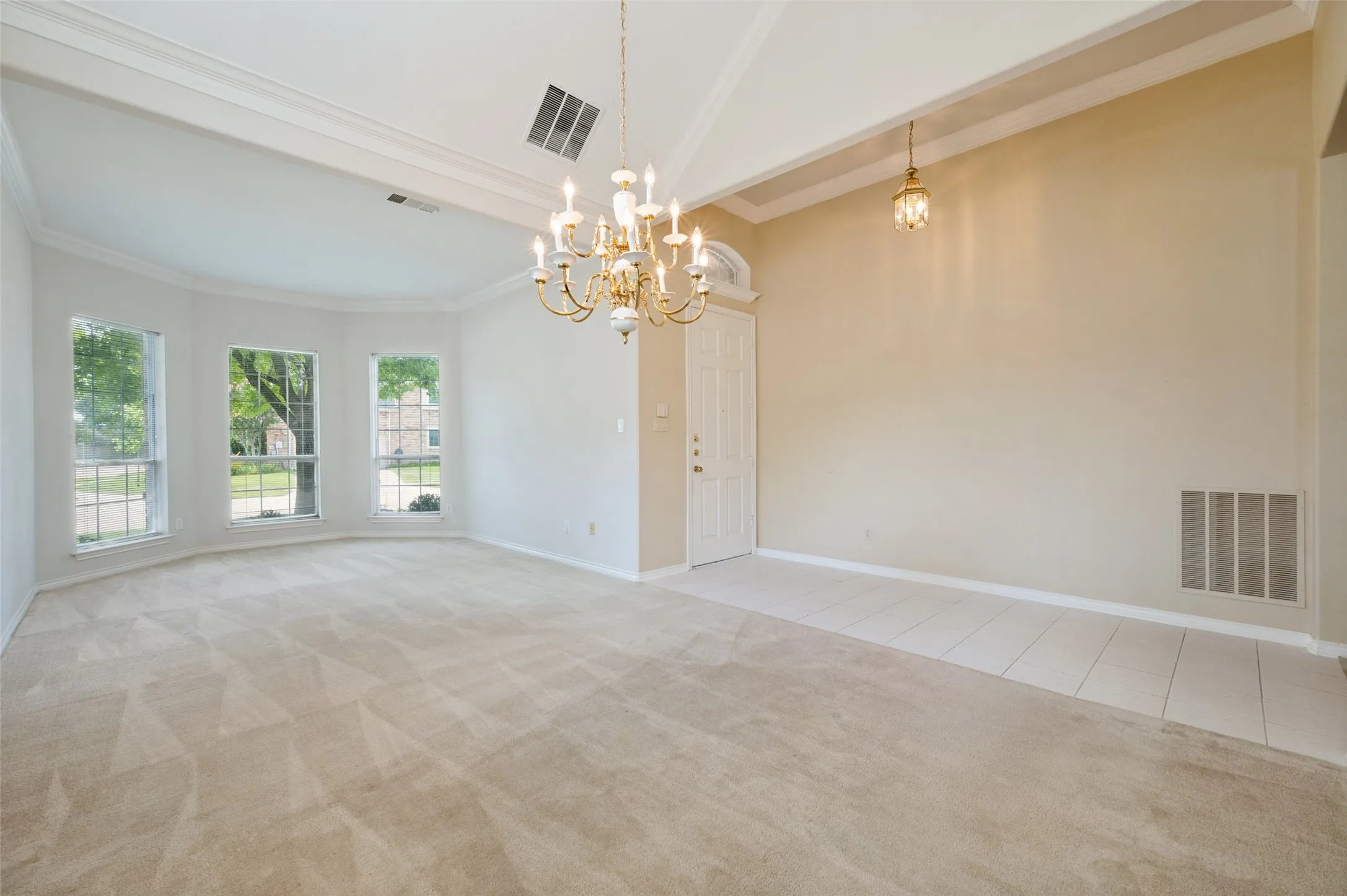 Spacious Living/Dining with bay windows.