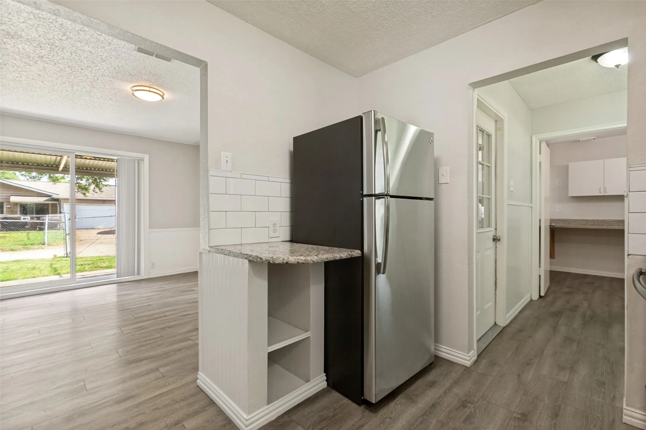You will enjoy a small Office/Bonus Room and a Separate Laundry Room next to the Kitchen.