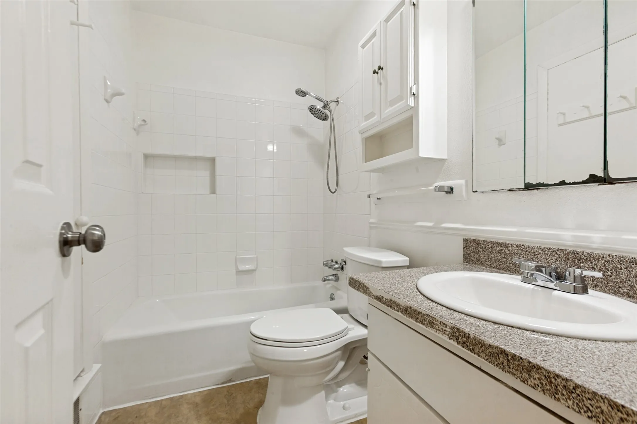 Hall Bath  is convenient to Secondary Bedrooms and to Living Area.