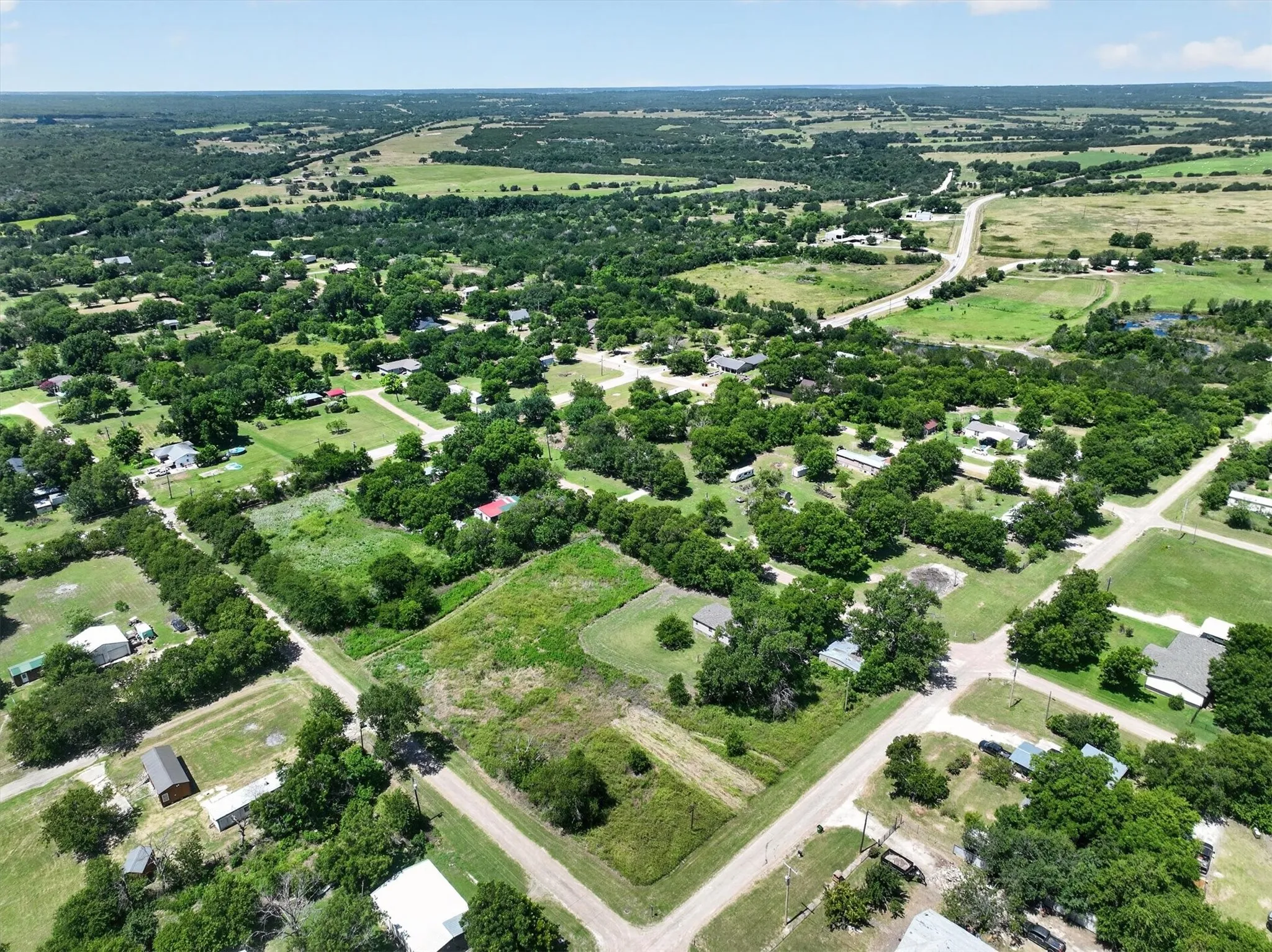 Expansive aerial perspective showcasing a rural landscape with scattered residential properties