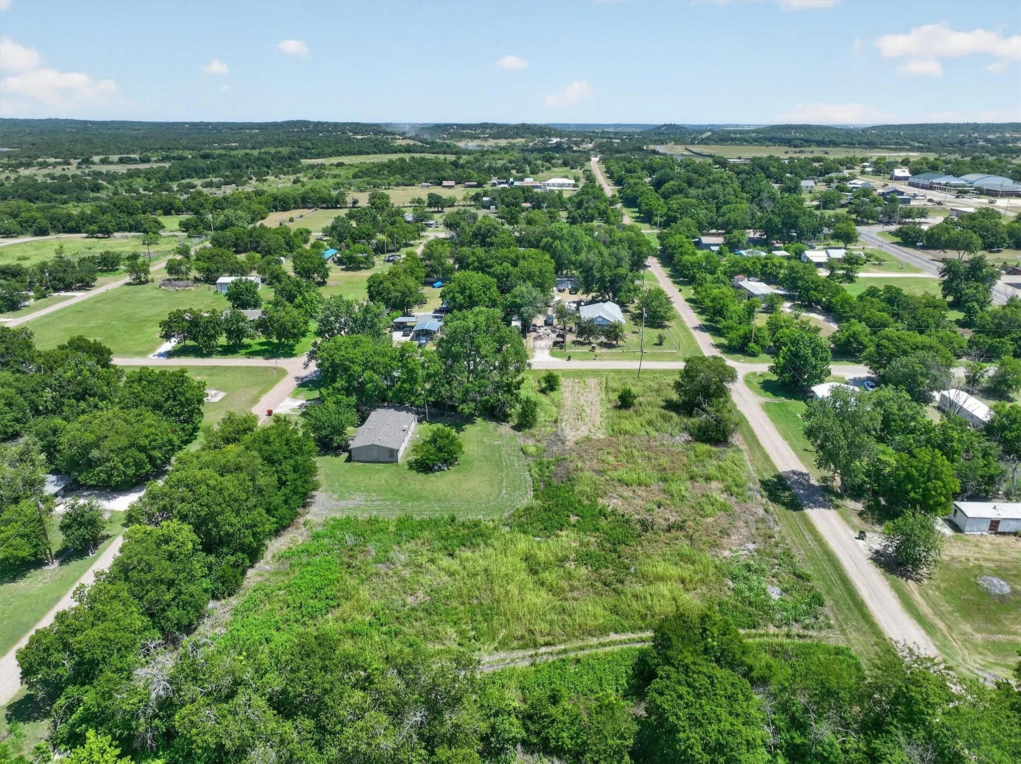Expansive undeveloped land featuring a combination of dense trees and open grassy areas