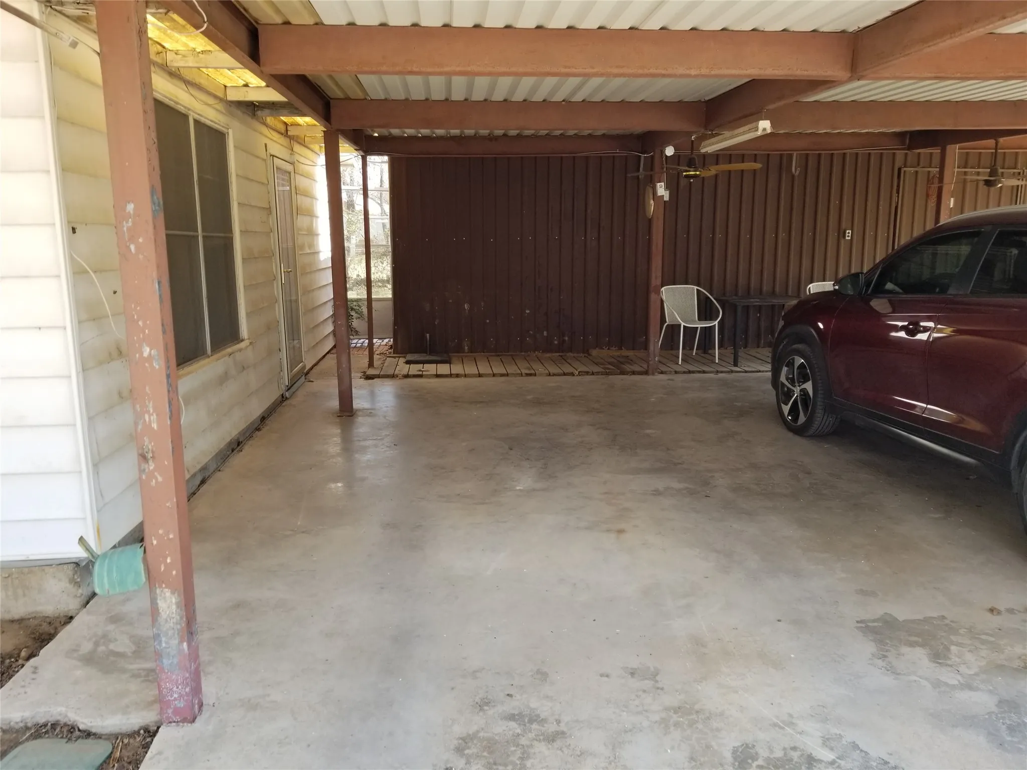 Carport w/ Workshop on far end.