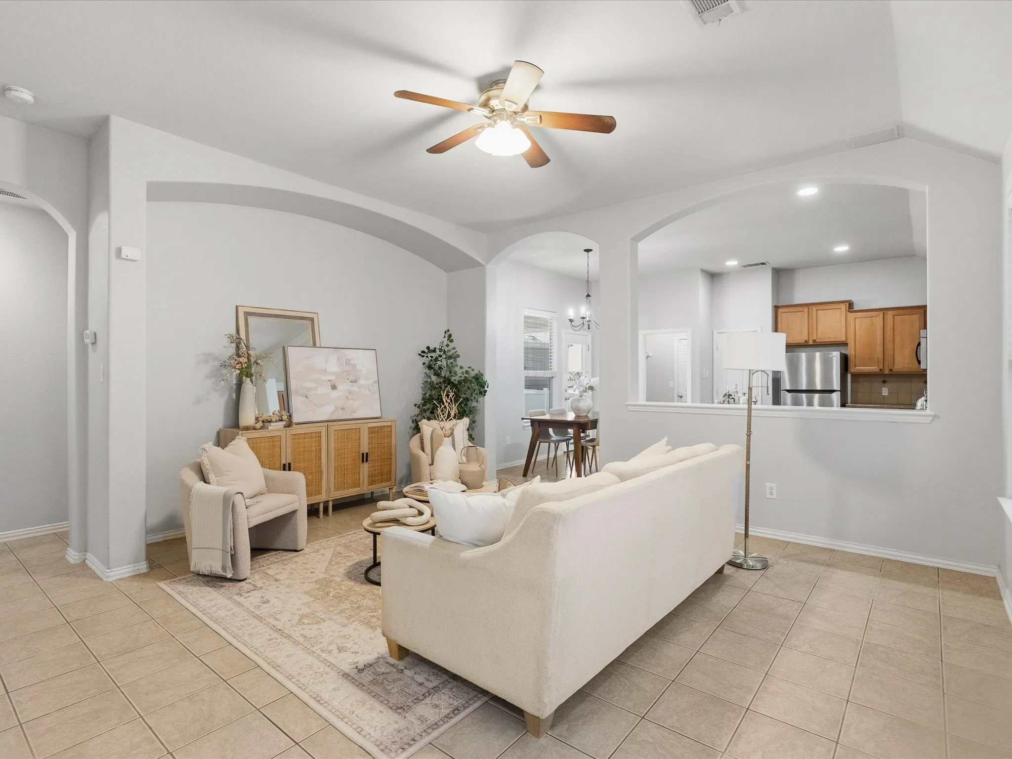 Spacious living room leads into separate dining and kitchen