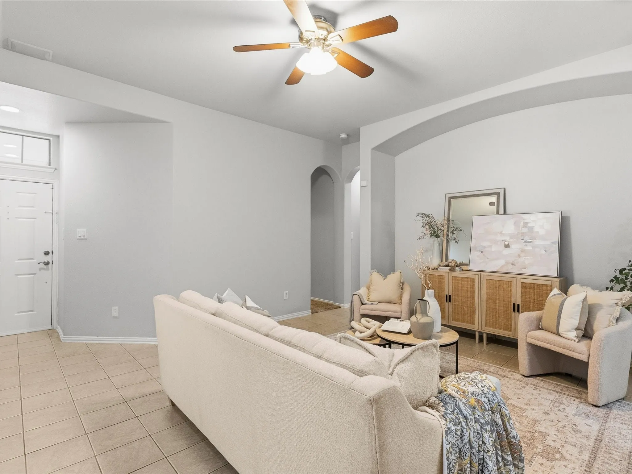 Spacious living room leads into separate dining and kitchen